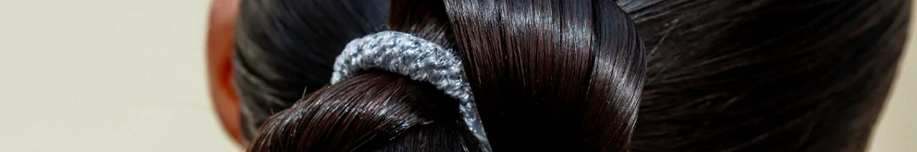 Alt Tag: Kkenekki durable gentle hair tie with unique weaving technique on sleek dark hair, stylish high-quality craftsmanship