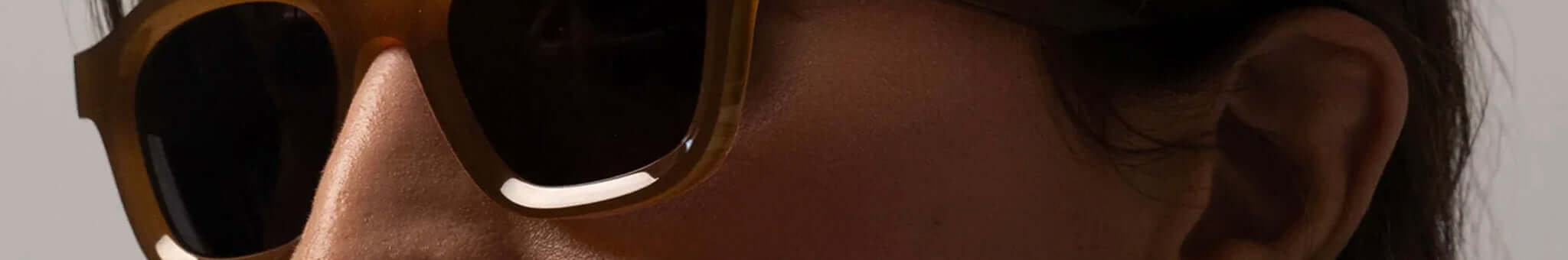 Isle of Eden tortoiseshell sunglasses close-up on face, classic contemporary sustainable New Zealand eyewear