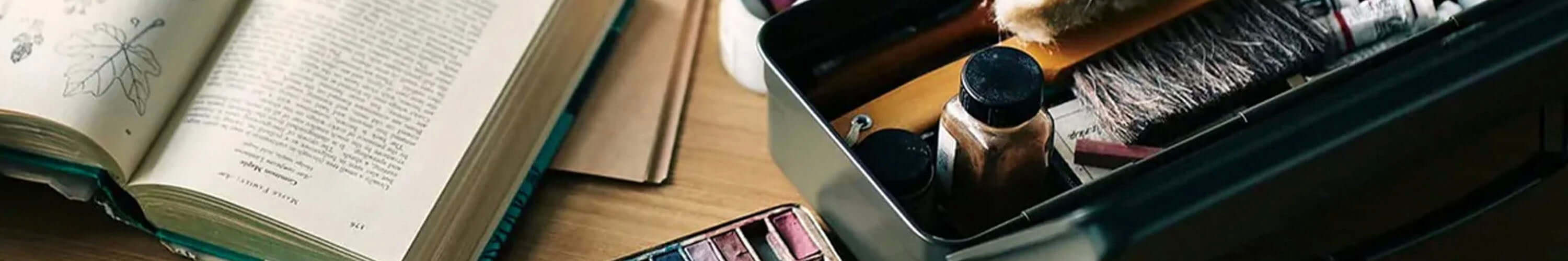 Alt Tag: Toyo Steel seamless Japanese toolbox with rugged beautiful design, open tool box beside books and desk accessories