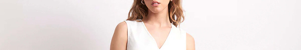 Neris women’s white sleeveless V-neck top, eco-friendly fashion from Christchurch New Zealand, timeless silhouette
