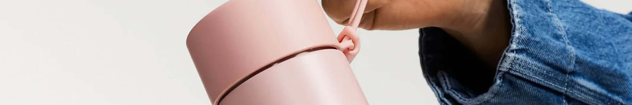 Alt Tag: Frank Green reusable pink travel mug with handle, sleek modern sustainable drinkware lifestyle product