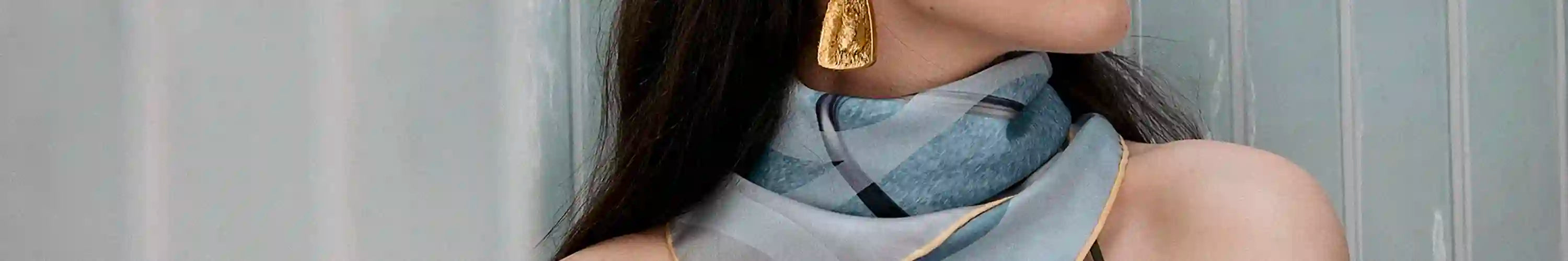 Good & Co luxury scarf with art-inspired graphic print, fine fabric accessory styled around neck by model