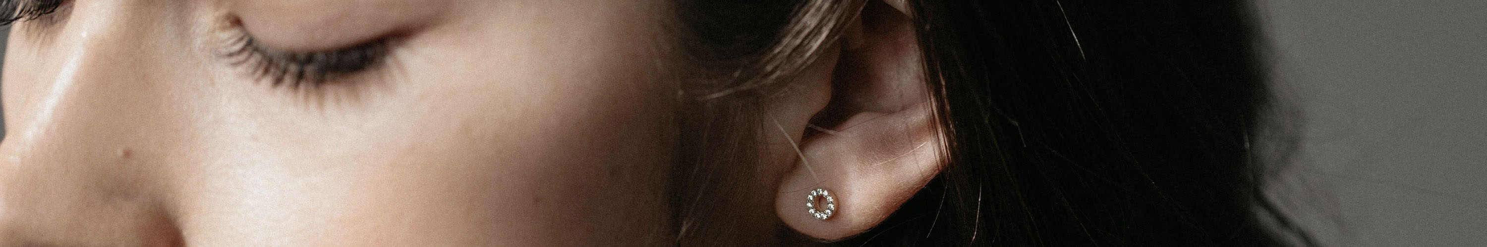 Alt Tag: Sophie sterling silver stud earring with 14-carat gold plating on model, stylish practical jewellery accessory close-up