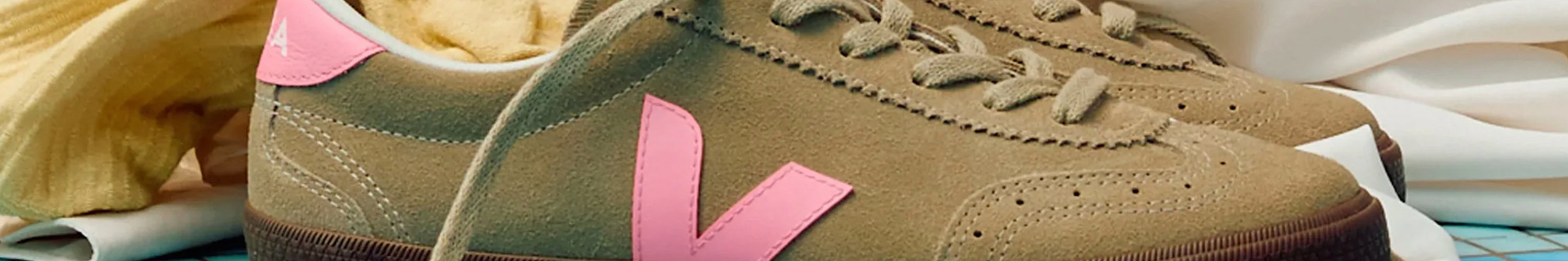 Veja eco-friendly fair trade white leather sneakers with suede V logo detail close-up