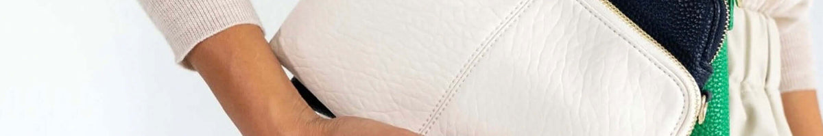 Elms+King white textured handbag close-up with a neutral outfit, timeless statement accessory