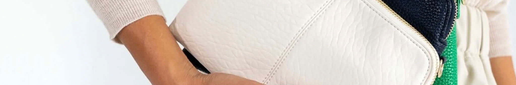 Alt Tag: Elms+King white textured handbag close-up with neutral outfit, chic statement accessory with timeless design and pops of colour