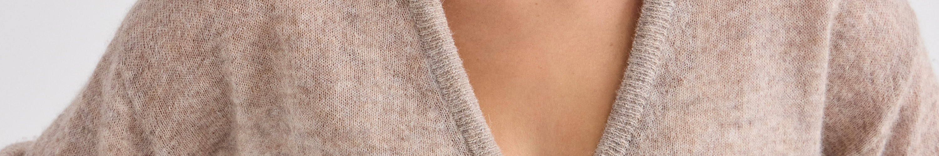 Alt Tag: Laing timeless cashmere crew sweater in soft pink with elegant neckline detail, designed to stay current for years