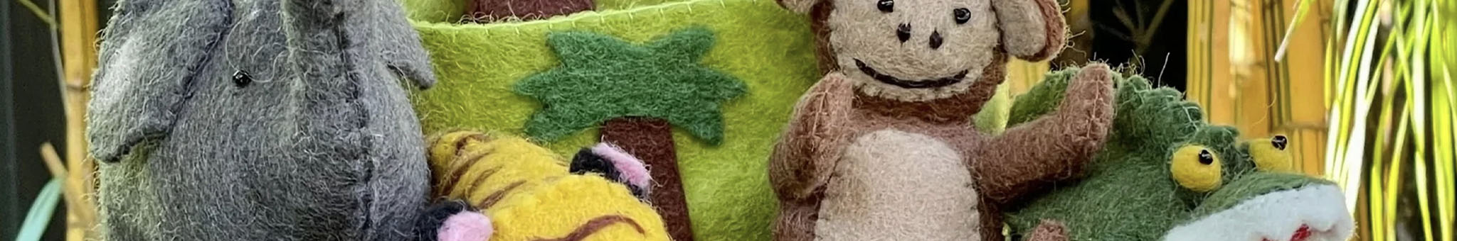 Alt Tag: Pashom fair-trade handmade felt toys from Nepal, monkey and elephant plush with colorful cushions, kids toy and decor