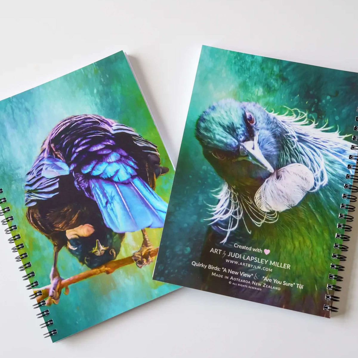 Art By JLM Bird Art Notebook - Quirky Tui featuring stunning Tui artwork covers with vibrant colors and spiral binding.