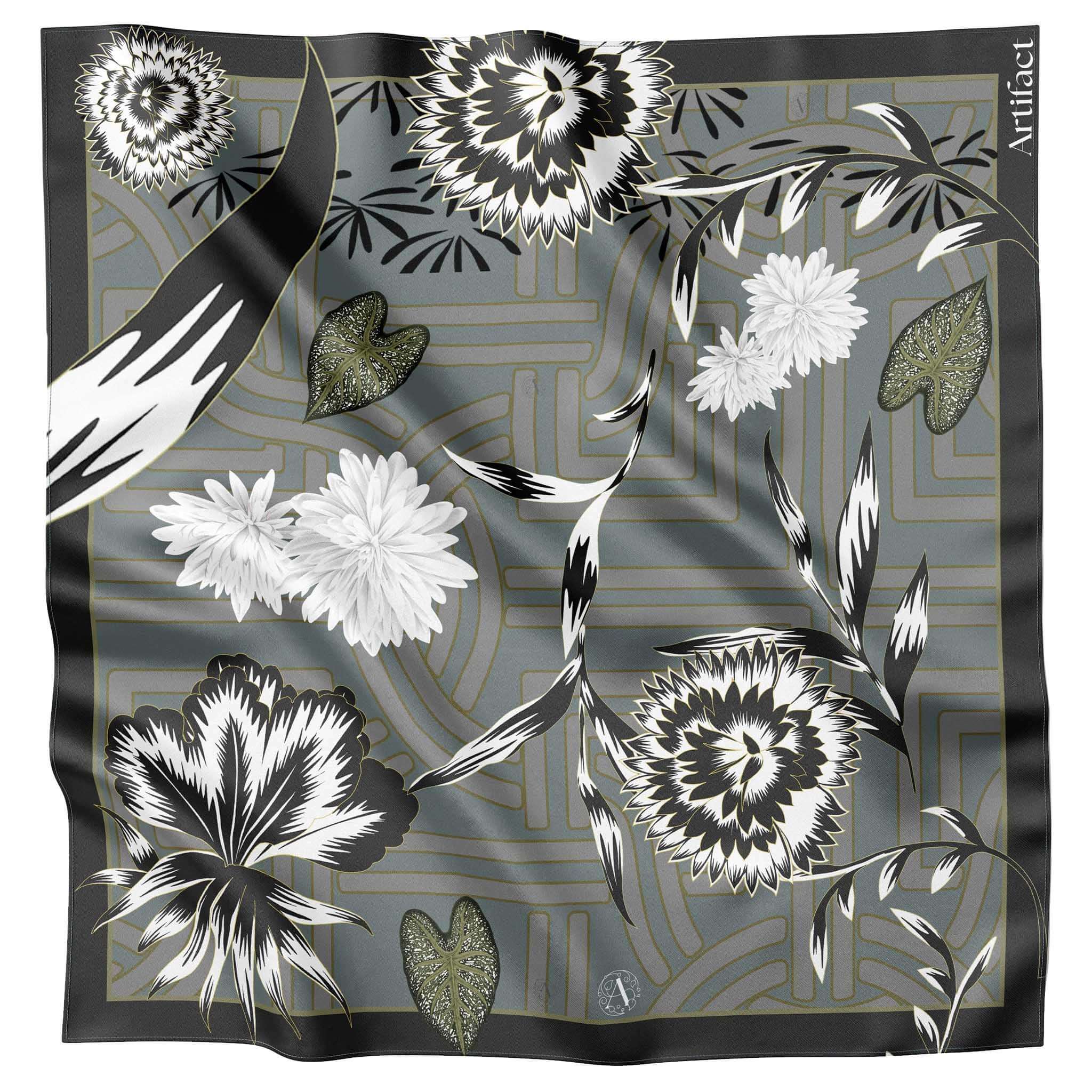 Alt Tag: Artifact Square Silk Scarf - Silva Noire with monochrome florals and stylised foliage on green geometric patterned backdrop