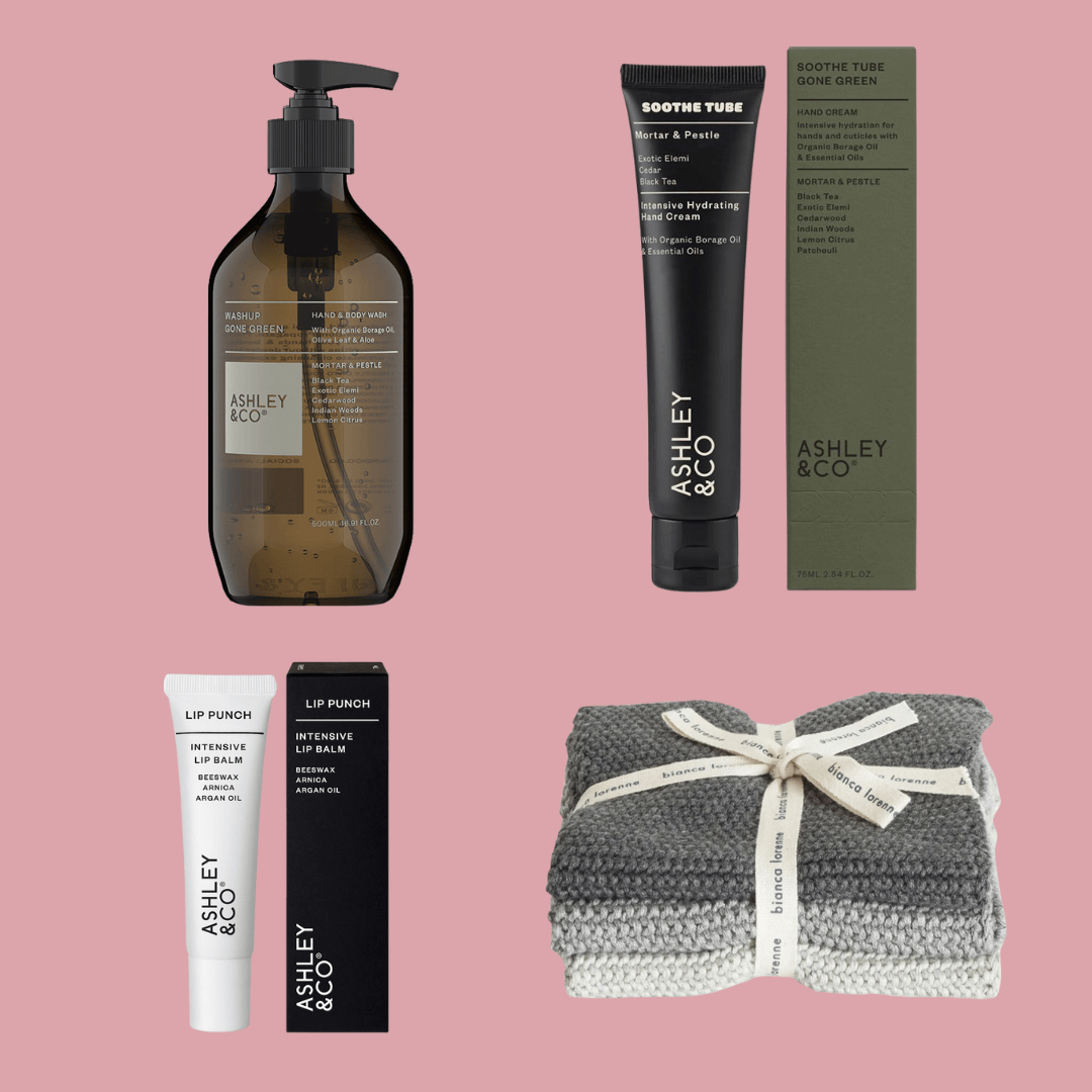 Alt Tag: Ashley & Co Gift Box - Gone Green Mortar & Pestle set with hand wash, soothe tube, lip balm and grey wash cloths on pink background