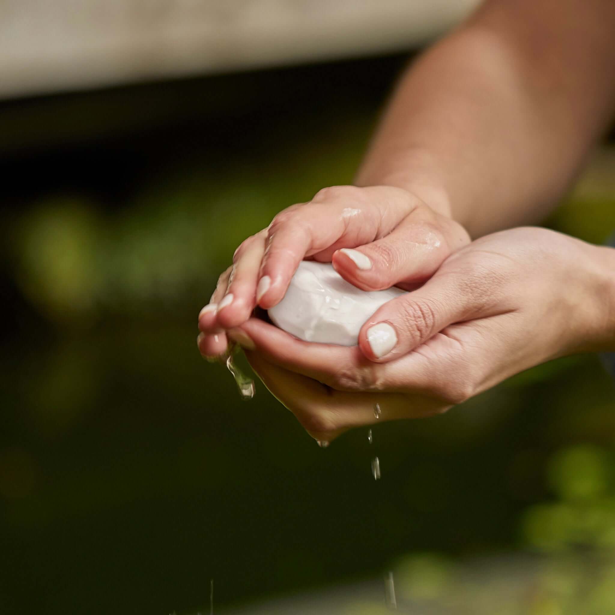 Ashley & Co Mini Bar Soap lathered in hands for gentle cleansing, goat’s milk and manuka honey bar soap