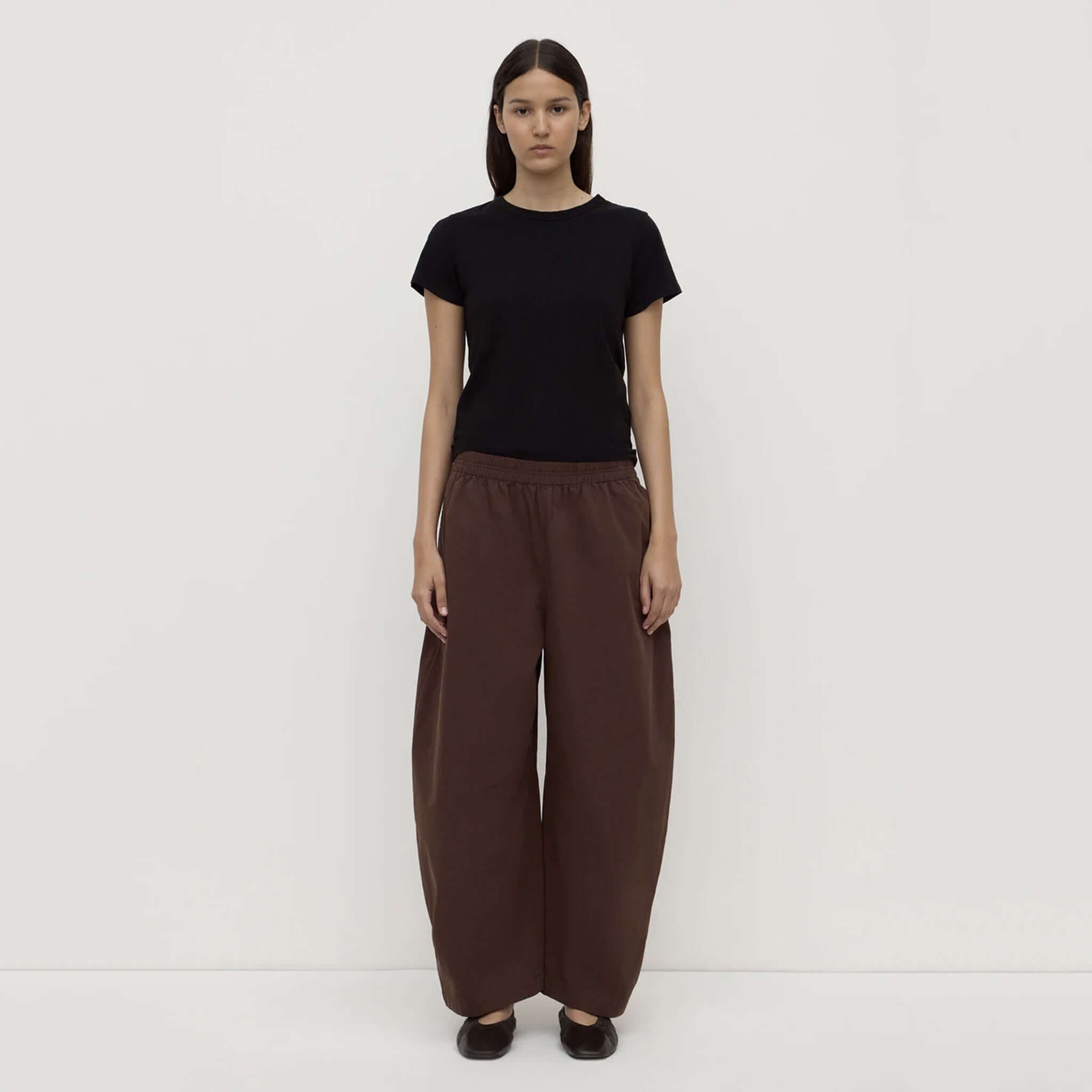 Model wearing Assembly Label Lola Barrel Pants - Ganache, showcasing relaxed fit and comfortable elastic waistband.