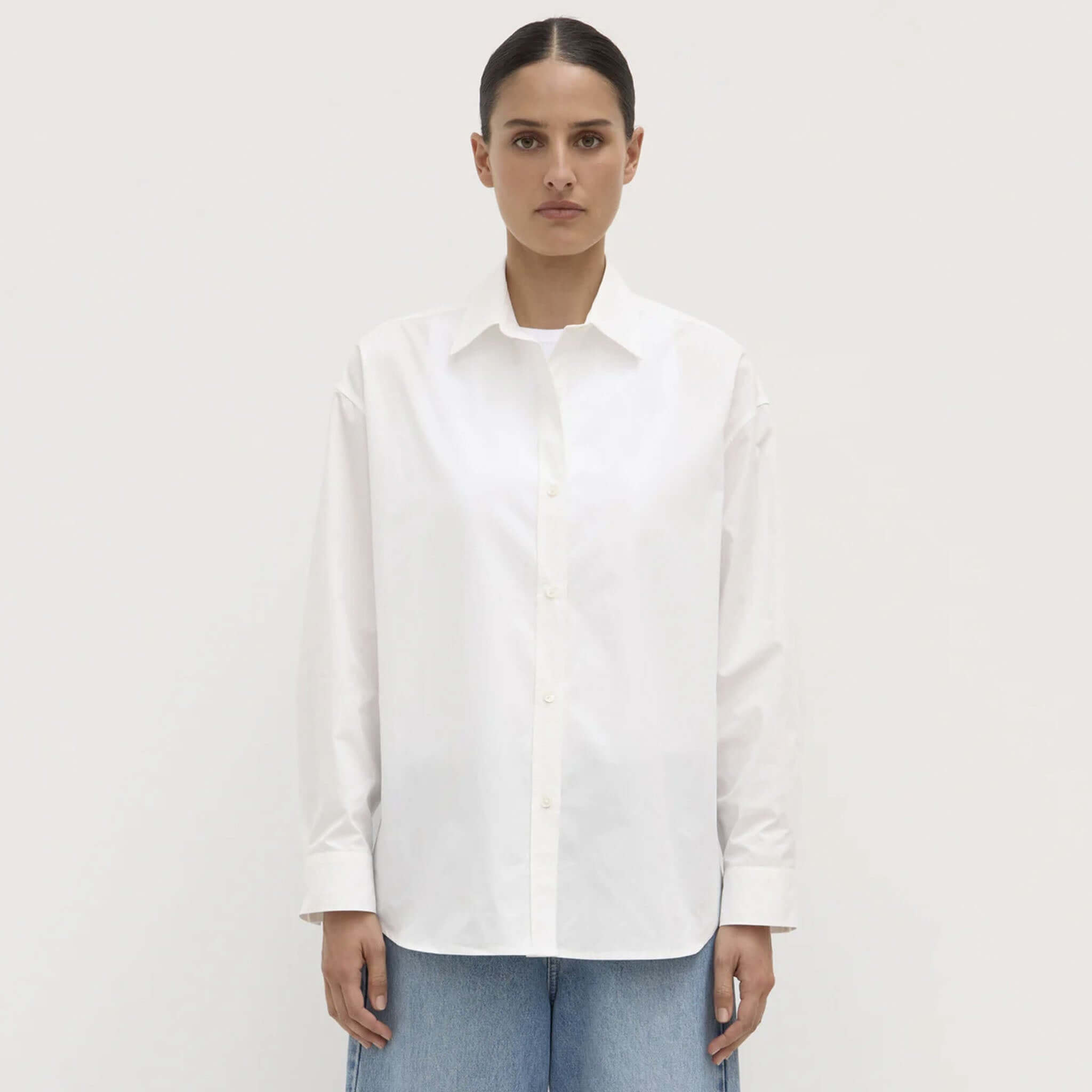 Alt Tag: Assembly Label Marigold Poplin Long Sleeve Shirt - White on model, relaxed fit 100% cotton poplin button-up with long sleeves