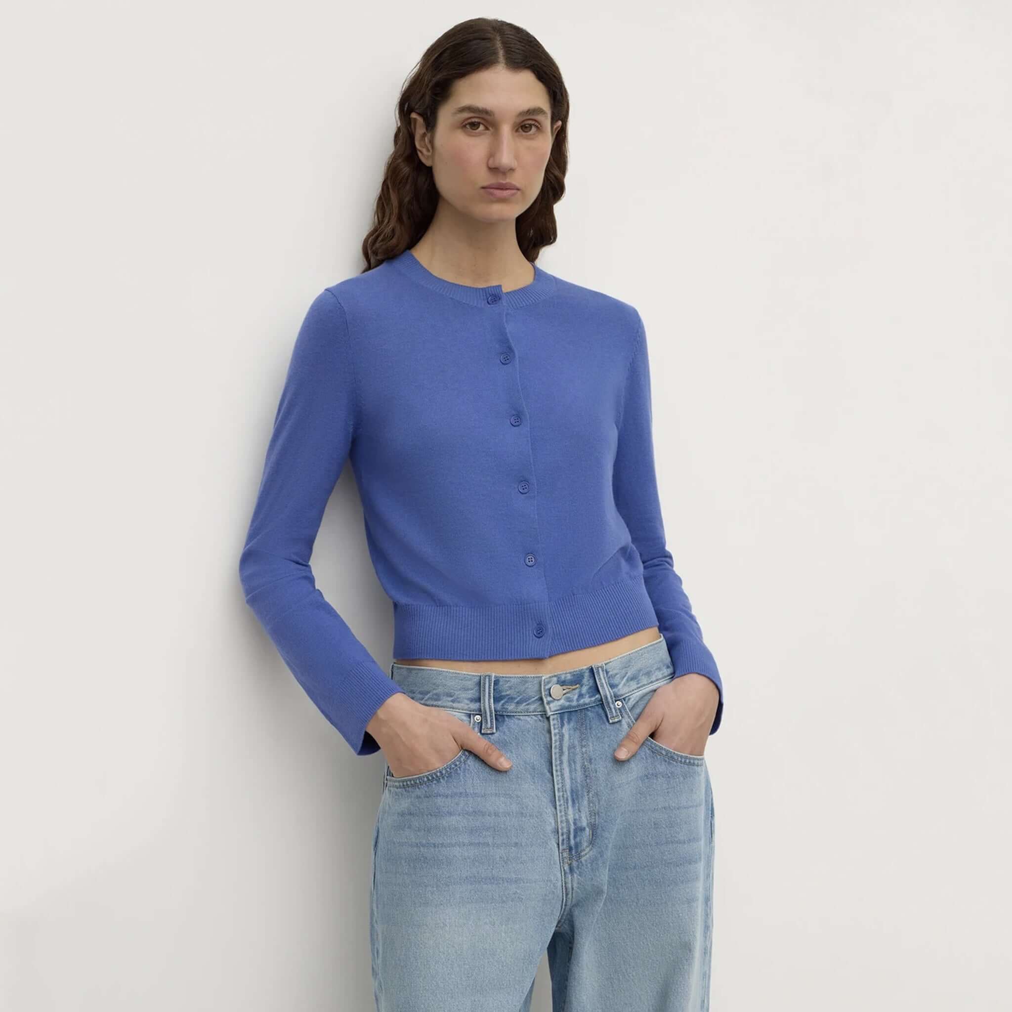 Assembly Label Orina Cotton Cashmere Cardigan - New Blue model wearing a cropped blue cardigan with button front and ribbed trims.
