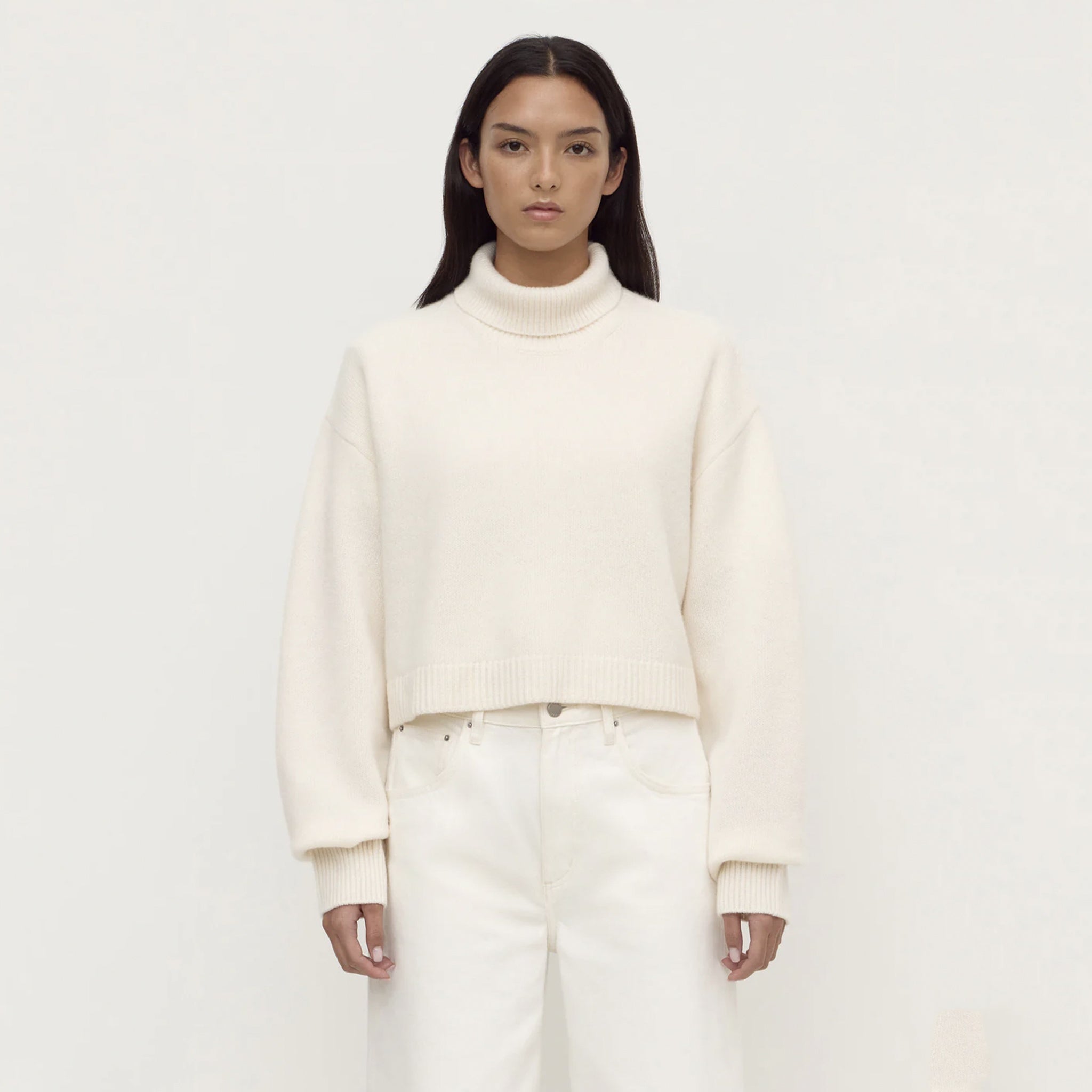 Assembly Label Paris Wool & Cashmere Knit Turtleneck - White on a model, showcasing its relaxed fit and cropped silhouette.