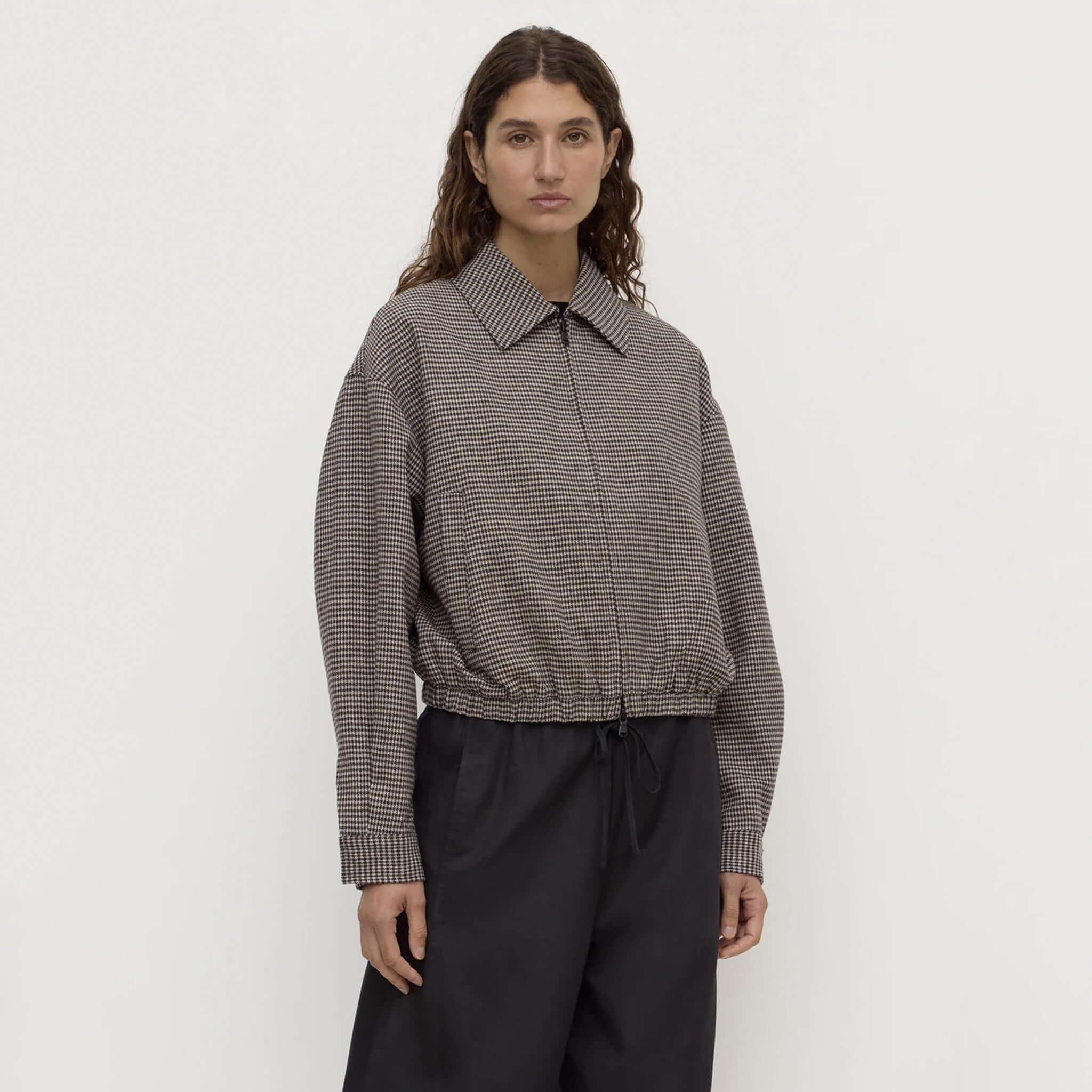Assembly Label brown black check wool jacket on model, featuring a cropped design and relaxed fit.