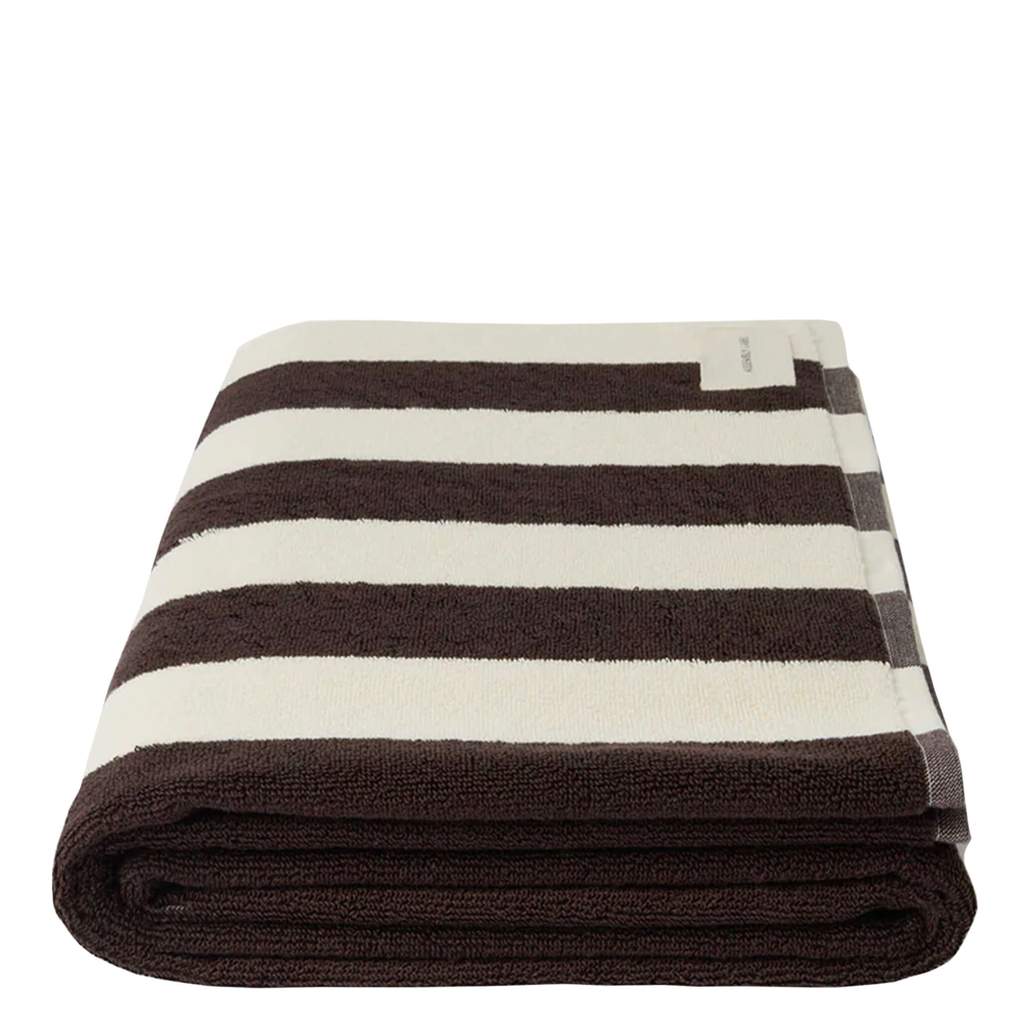 Folded brown and white striped towel on a white background