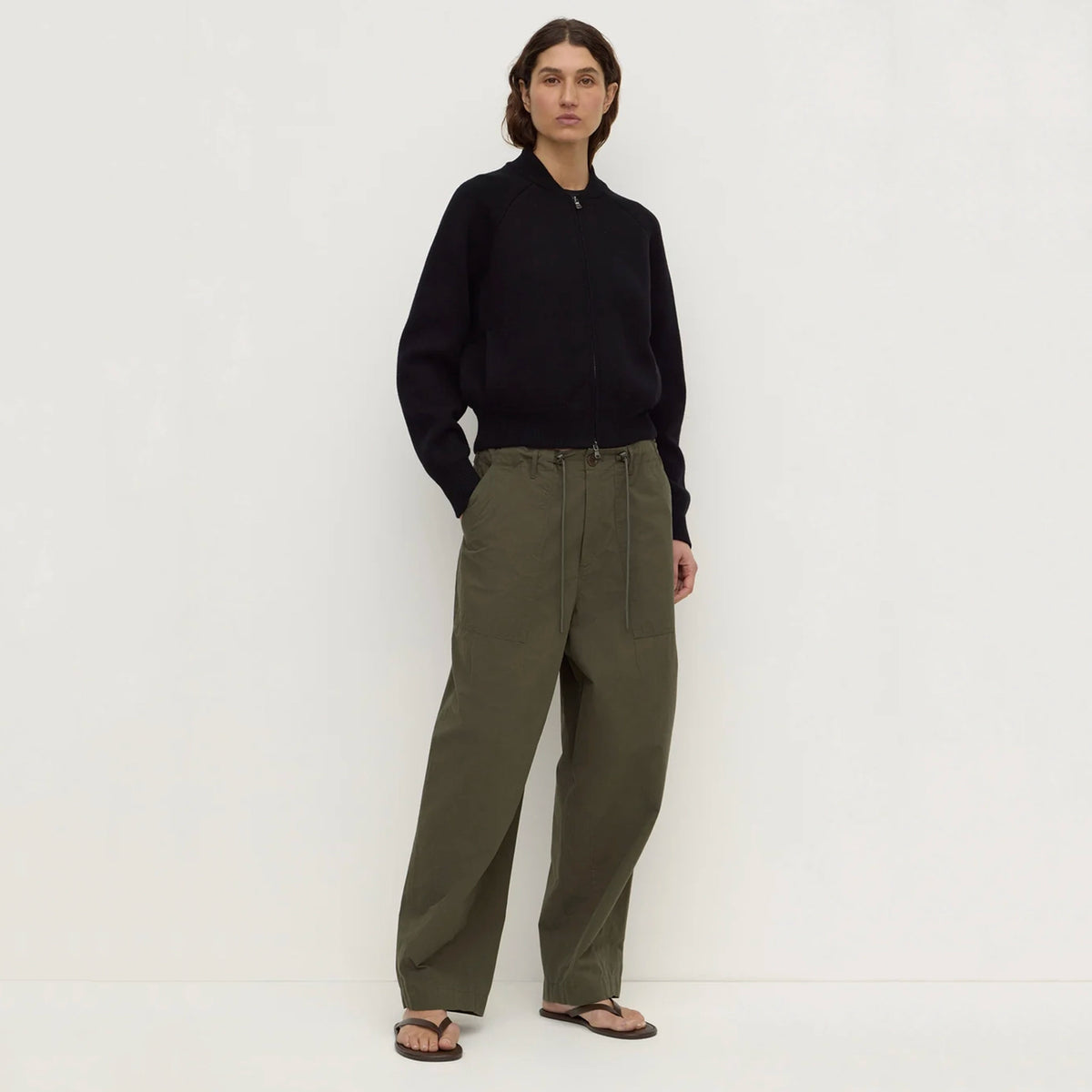 Assembly Label Gigi Utility Pants - Dark Military, model with hands in pockets showing relaxed fit