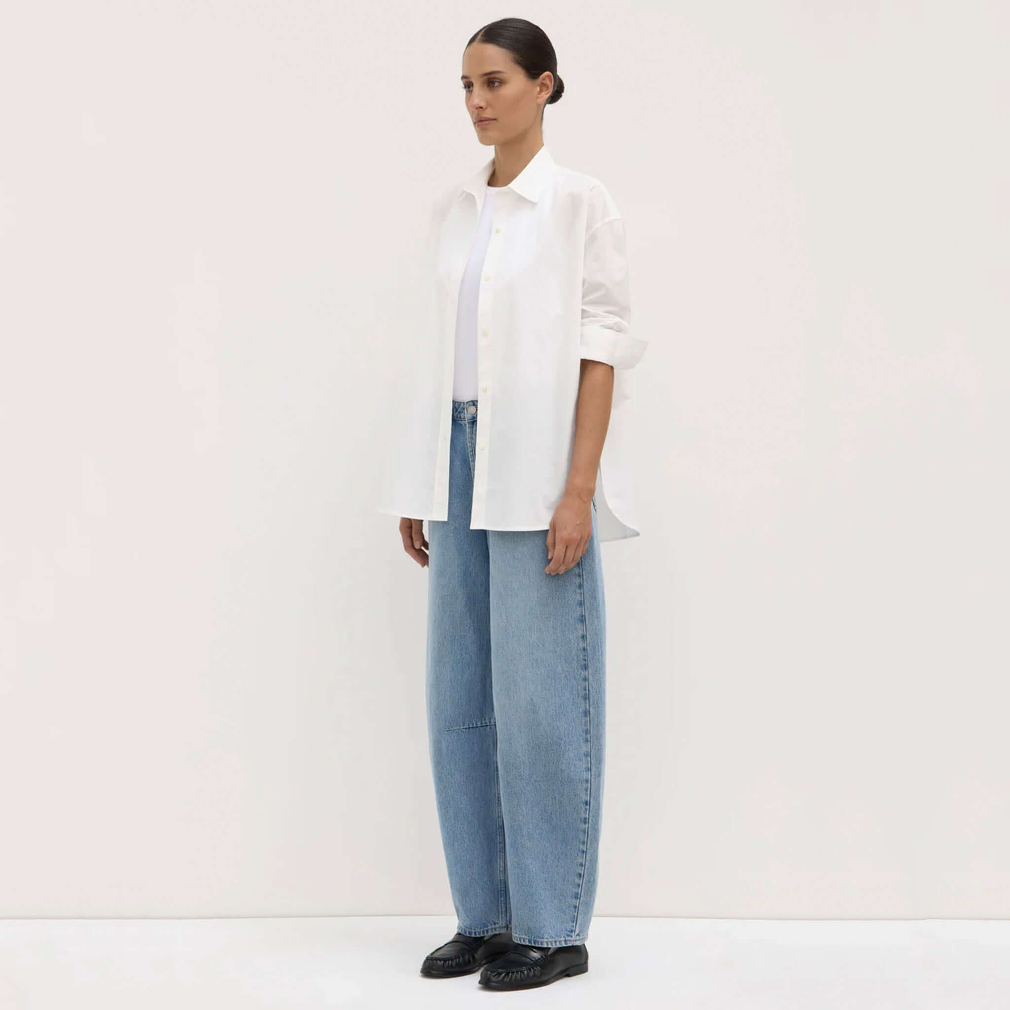 Alt Tag: Assembly Label Marigold Poplin Long Sleeve Shirt - White on model, relaxed fit white cotton poplin button-up with long sleeves