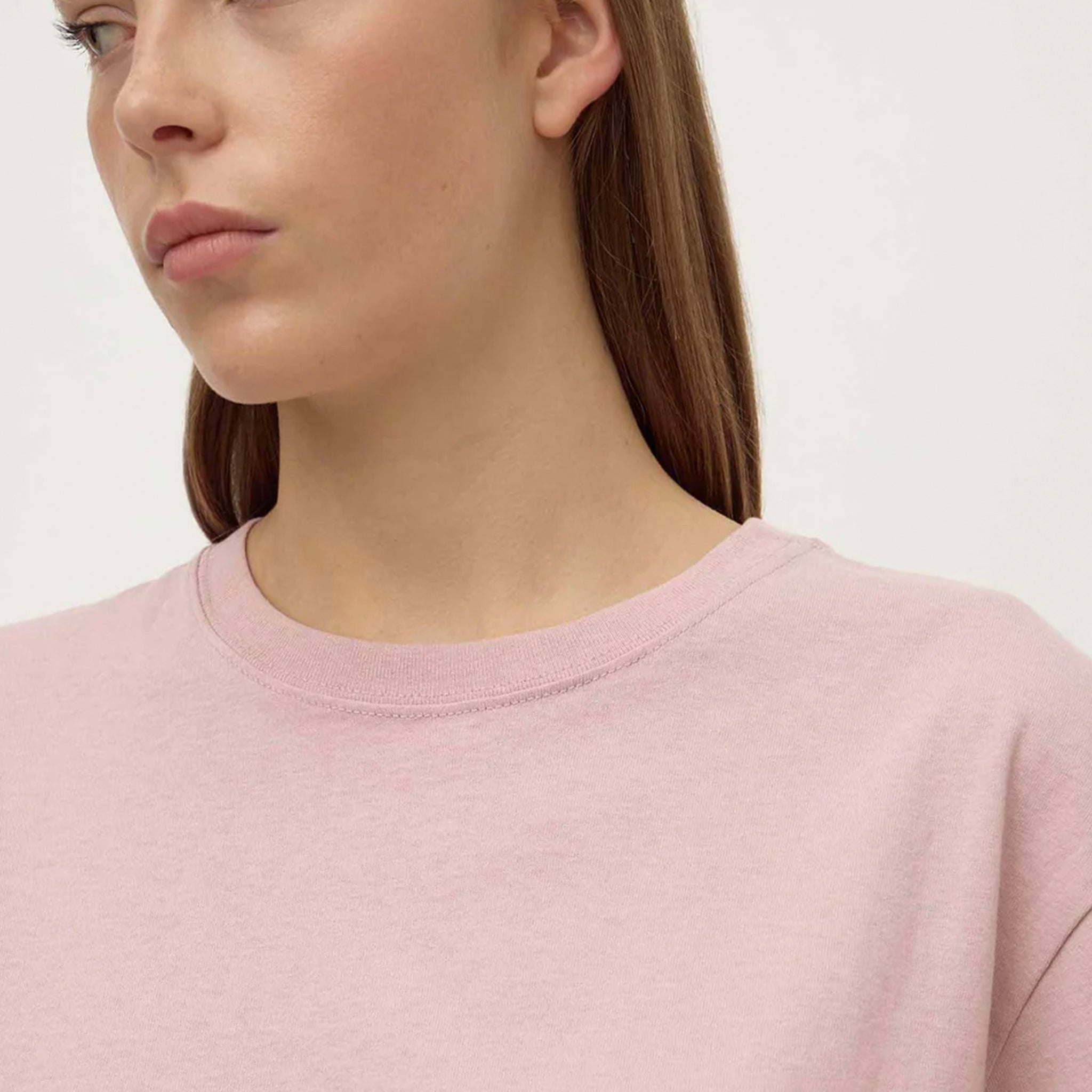 Alt Tag: Assembly Label Organic Cotton Base Tee - Blush close-up of blush pink crew neck organic cotton jersey t-shirt