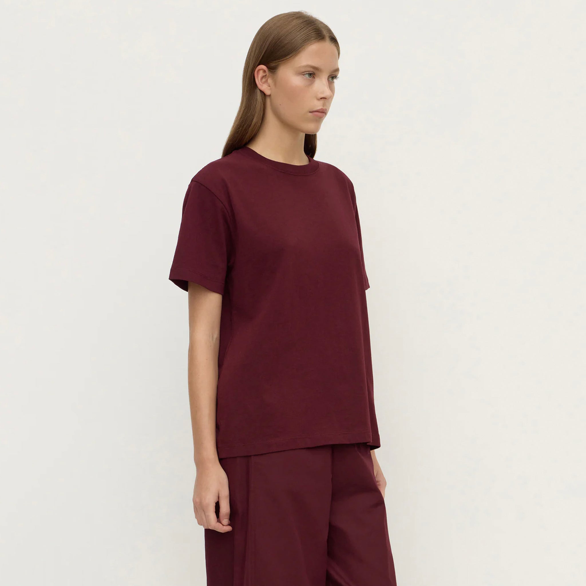 Alt Tag: Assembly Label Organic Cotton Base Tee - Merlot on model, relaxed crew neck 100% organic cotton jersey minimalist everyday essential