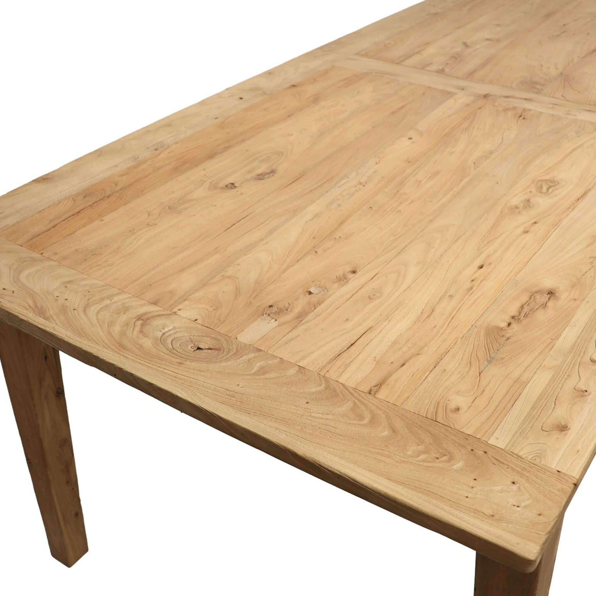 Alt Tag: Basque Reclaimed Elm Dining Table close-up of reclaimed elm wood tabletop with natural grain and tapered leg