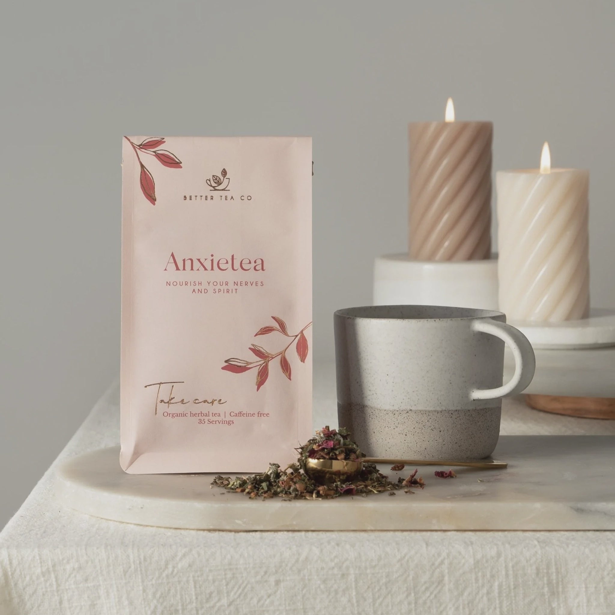 Anxietea tea packaging with a cup and candles on a neutral background