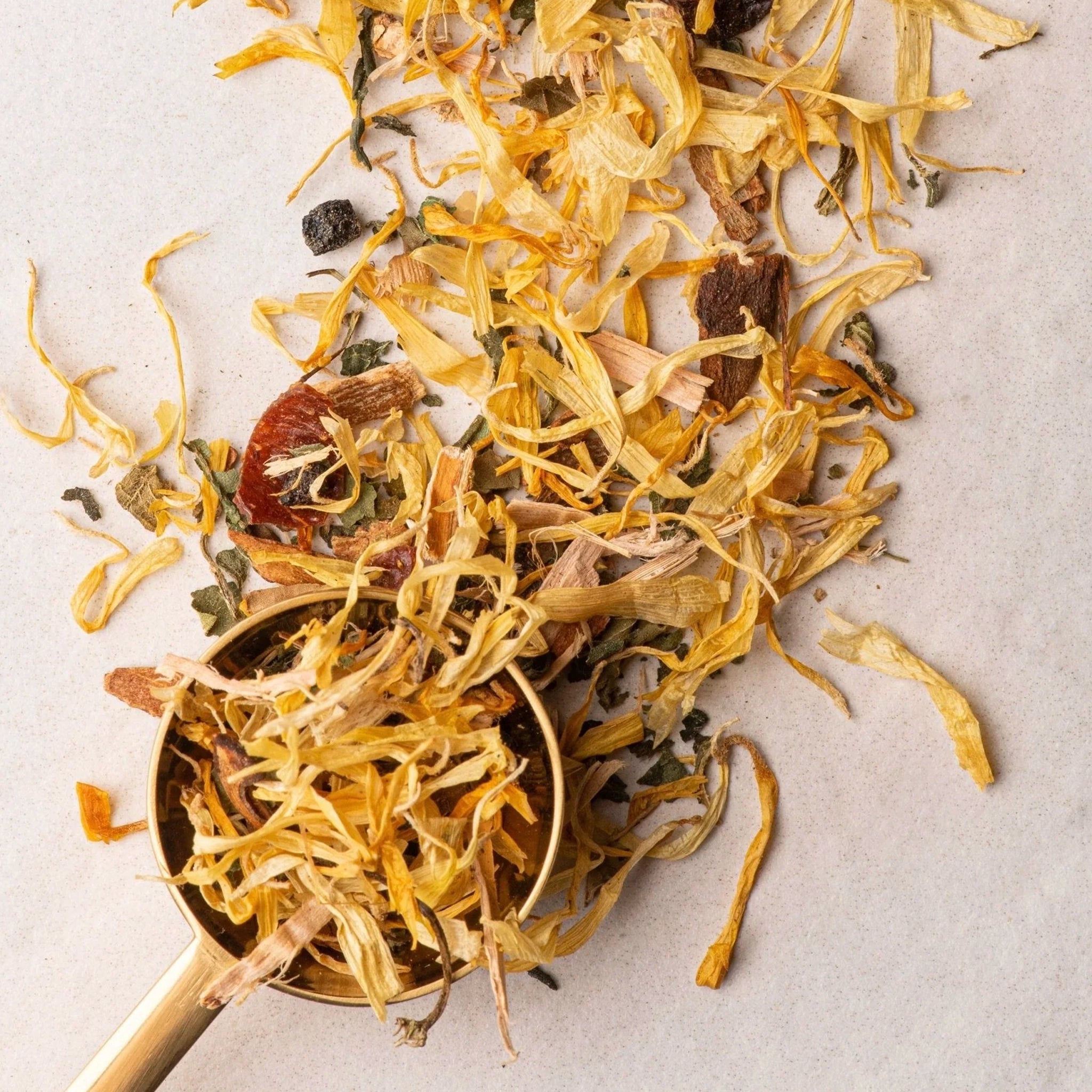 Tea leaves on a white surface