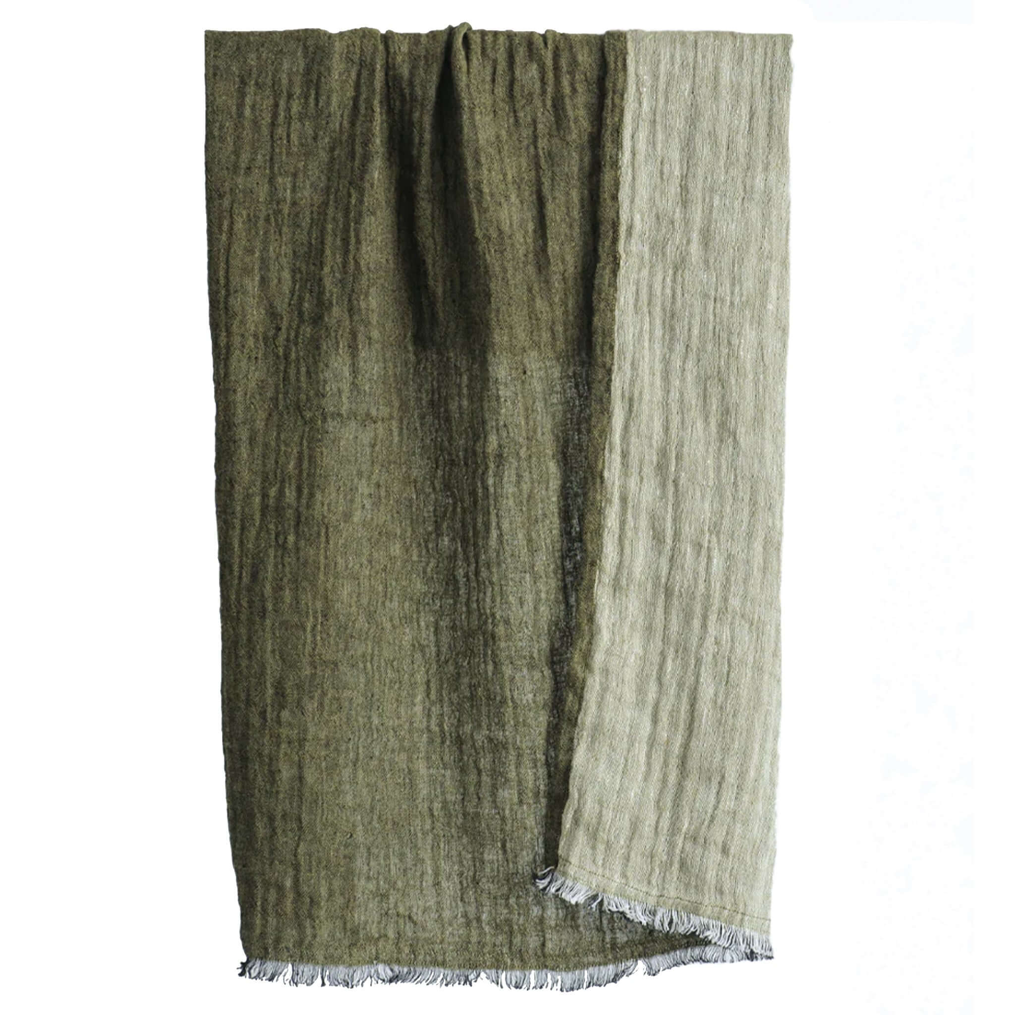 Green and beige hand towel with frayed edges on a white background