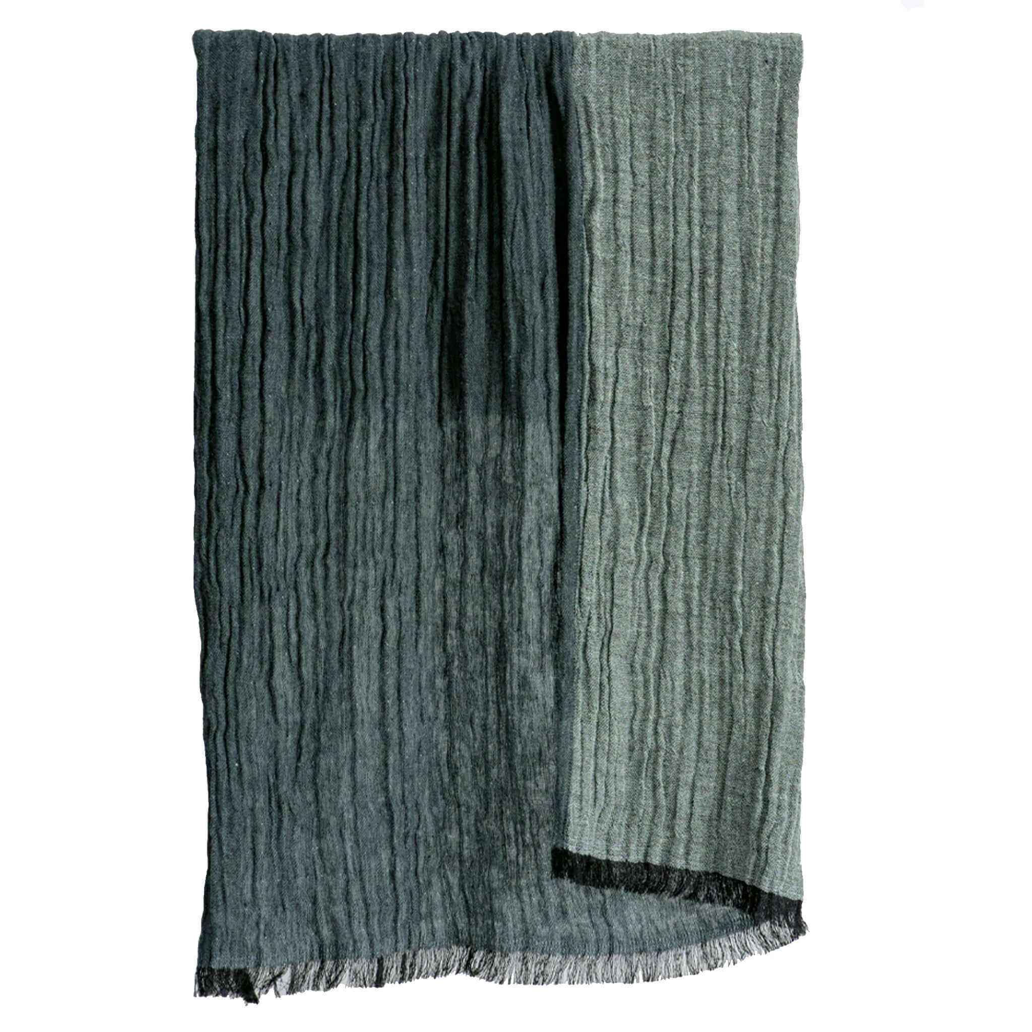 Textured hand towel with fringe on a white background