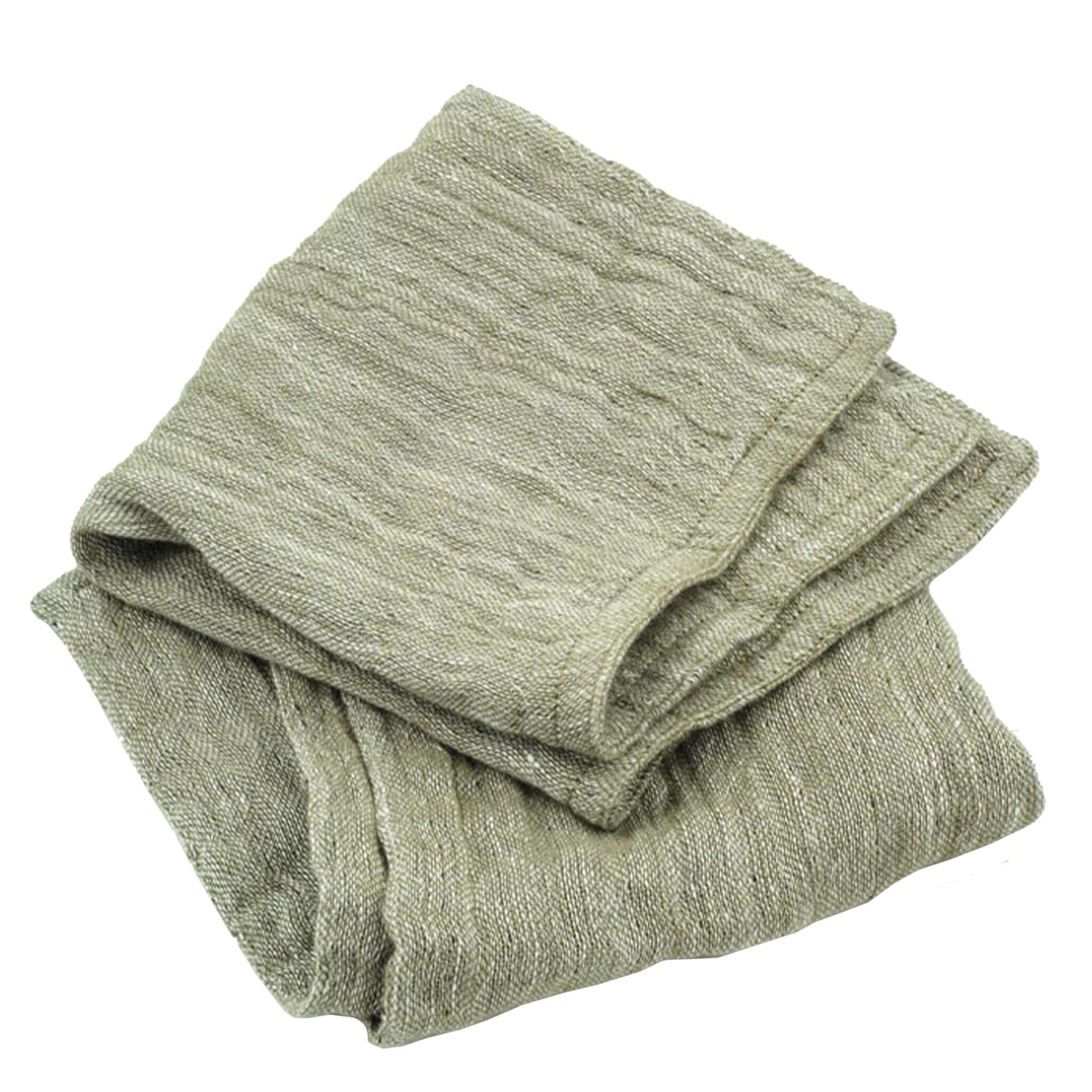 Folded green wash cloth on a white background