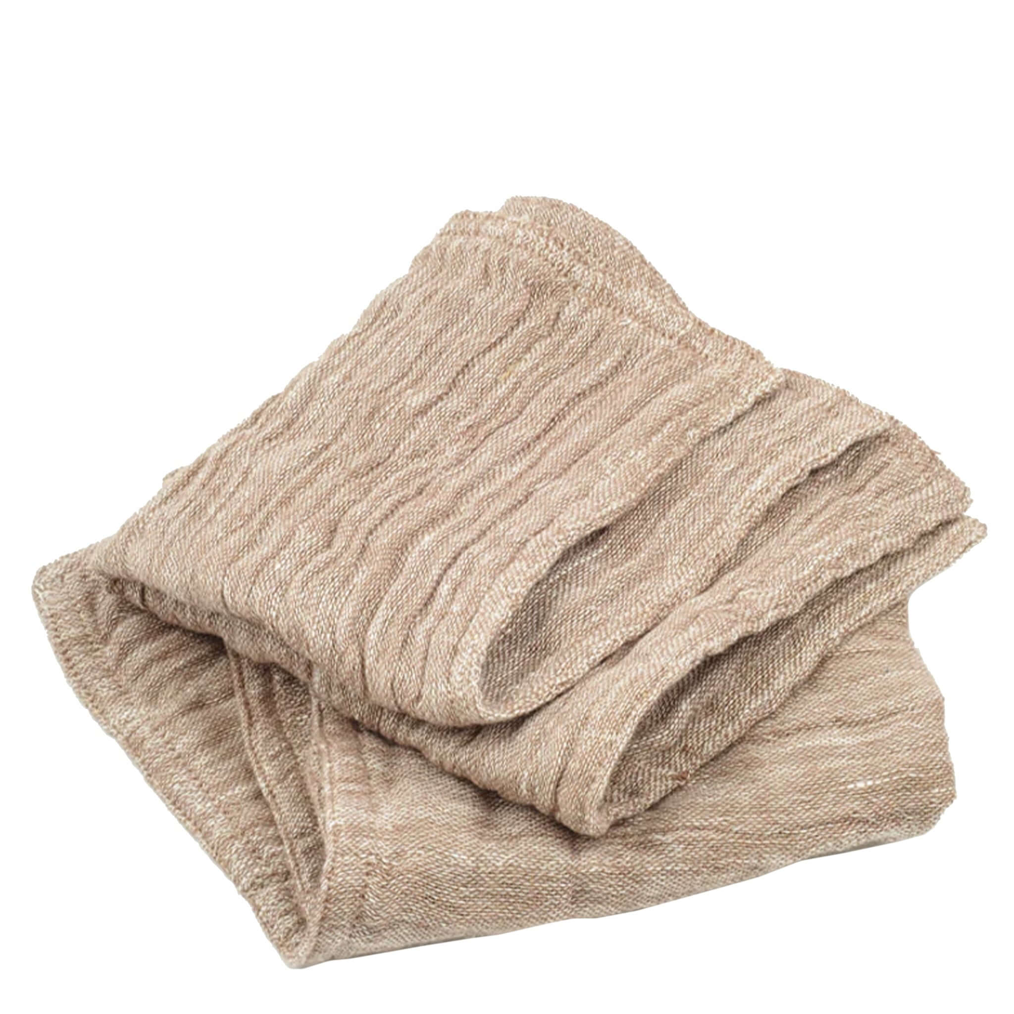 Folded beige wash cloth on a white background