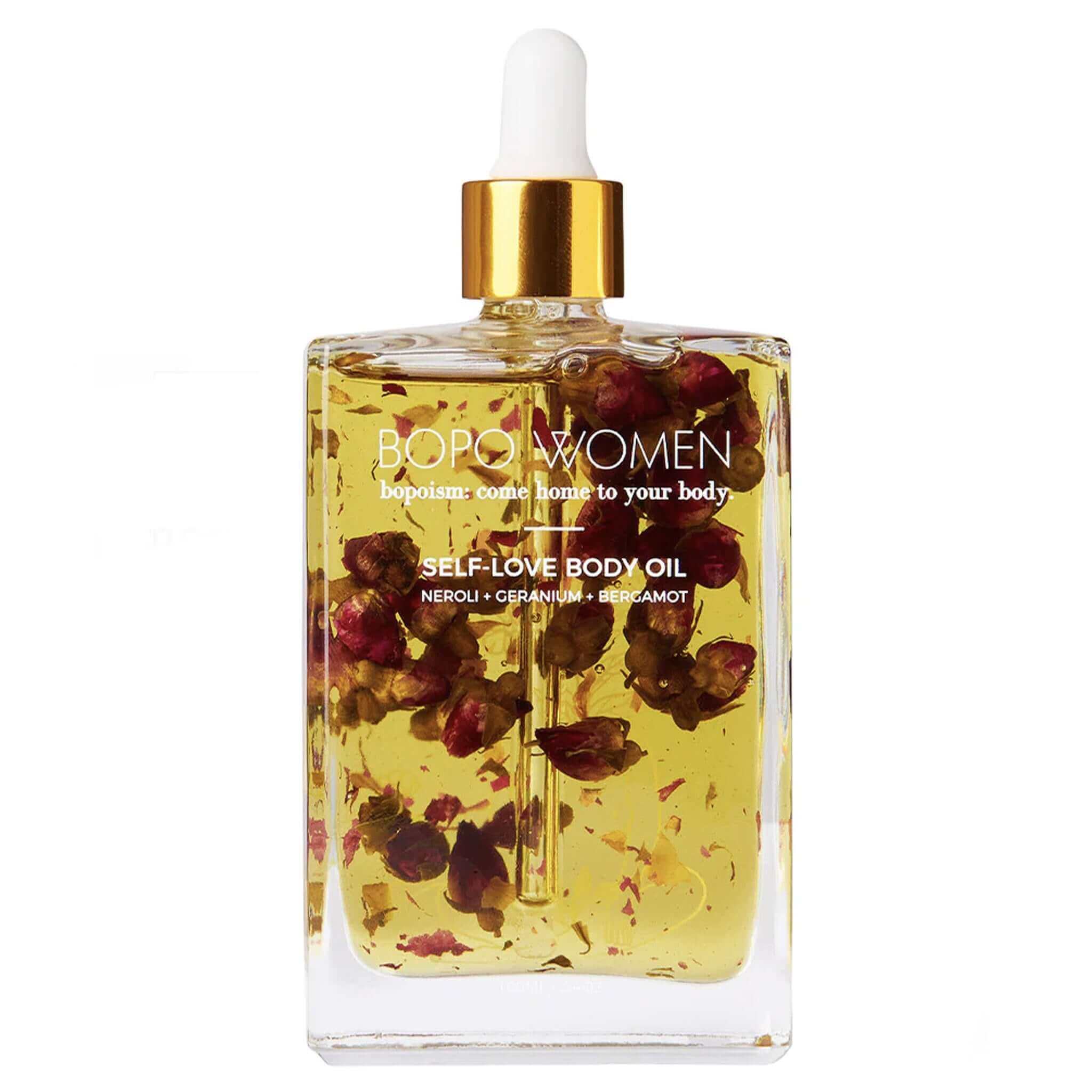 Bottle of Bopo Women self-love body oil with dried flowers on a white background
