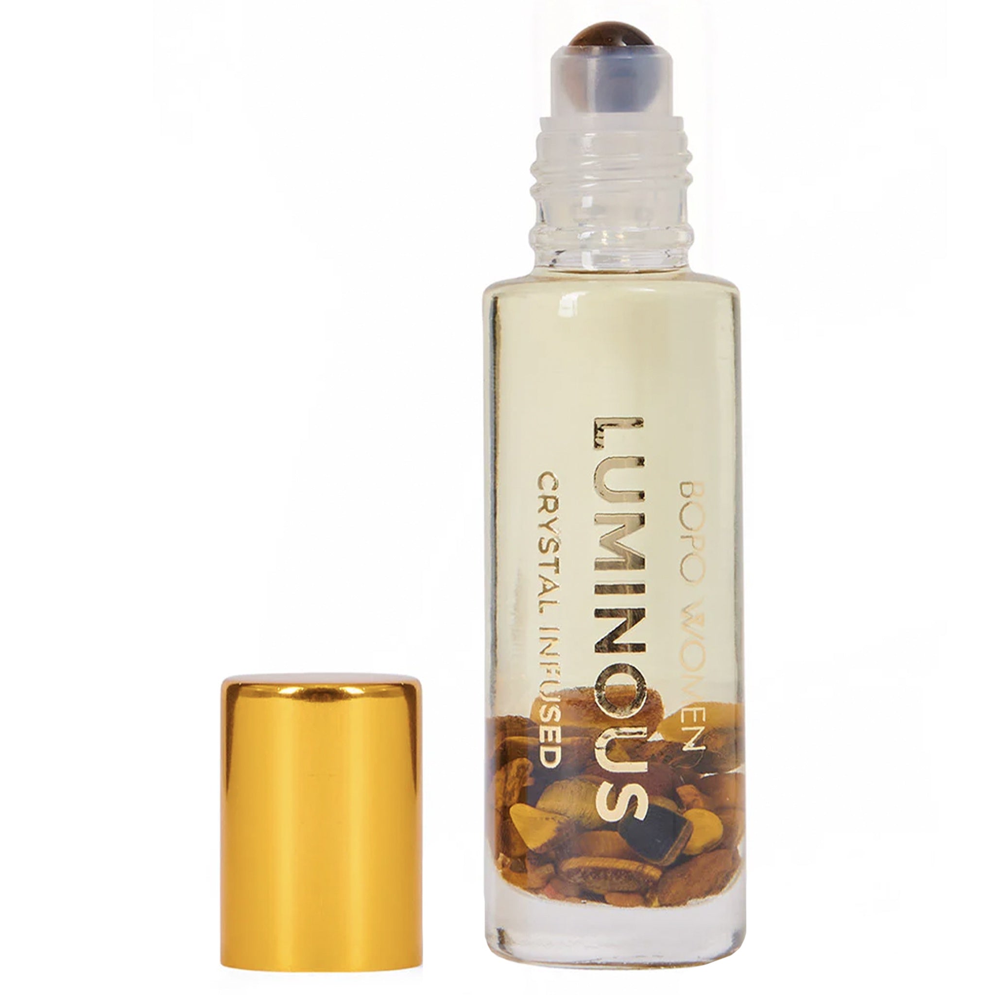 Luminous crystal-infused roller bottle with gold cap on a white background