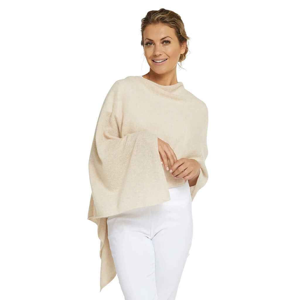 Alt Tag: Esperance & Co Classic Cashmere Topper - Latte worn as a soft cashmere poncho wrap, versatile office-to-travel layering gift