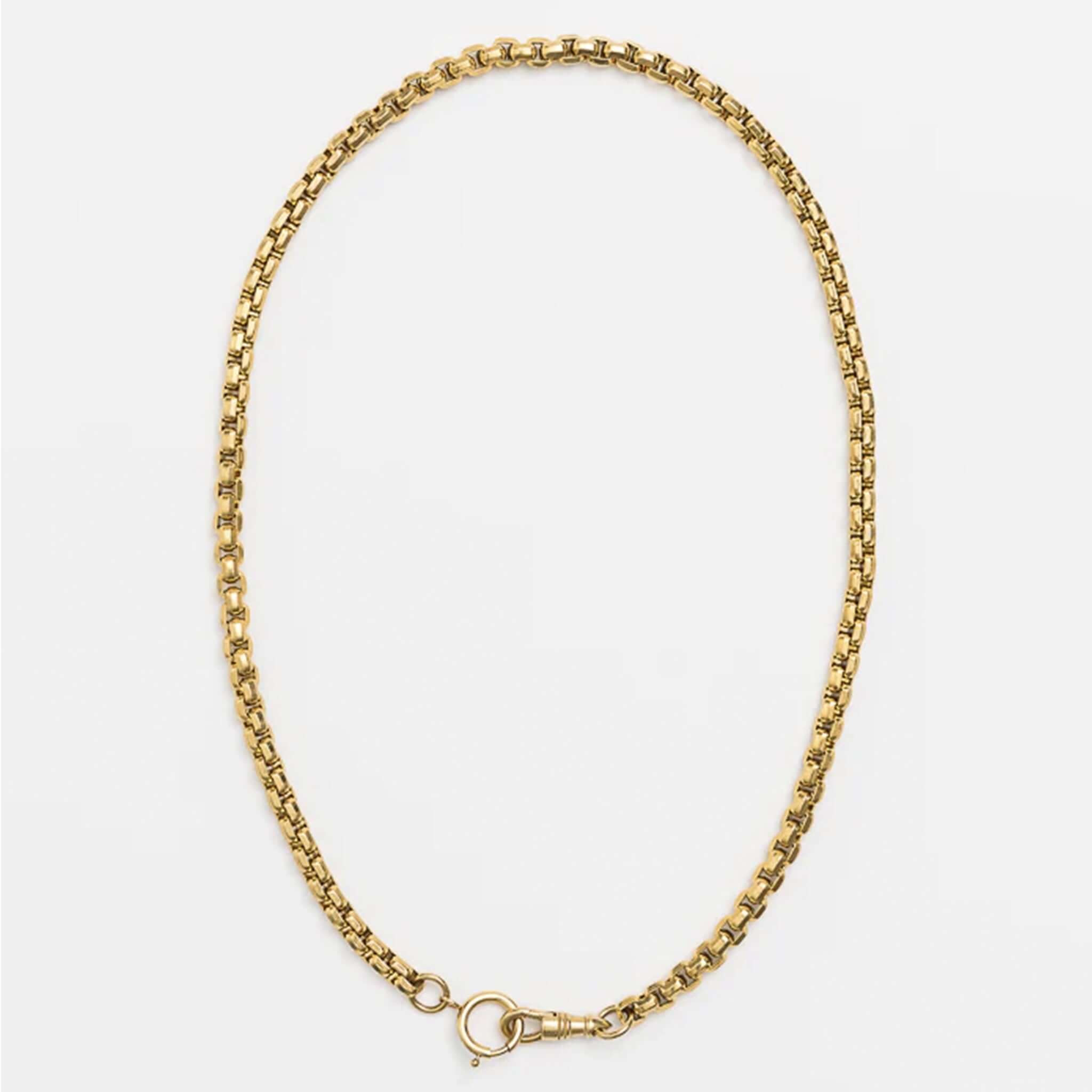Gold chain necklace on a white background