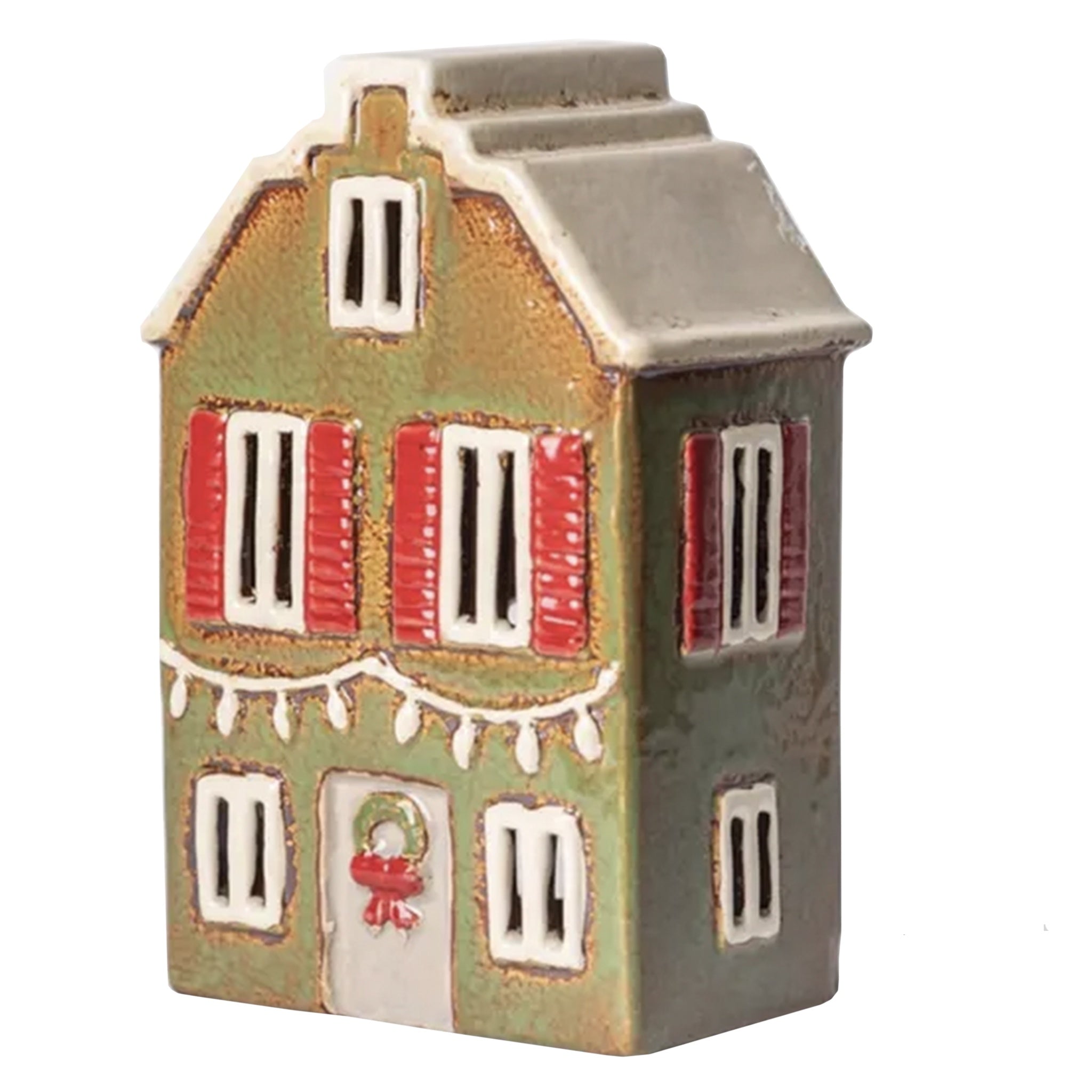 Small ceramic house with green facade, red windows, and white accents on a white background
