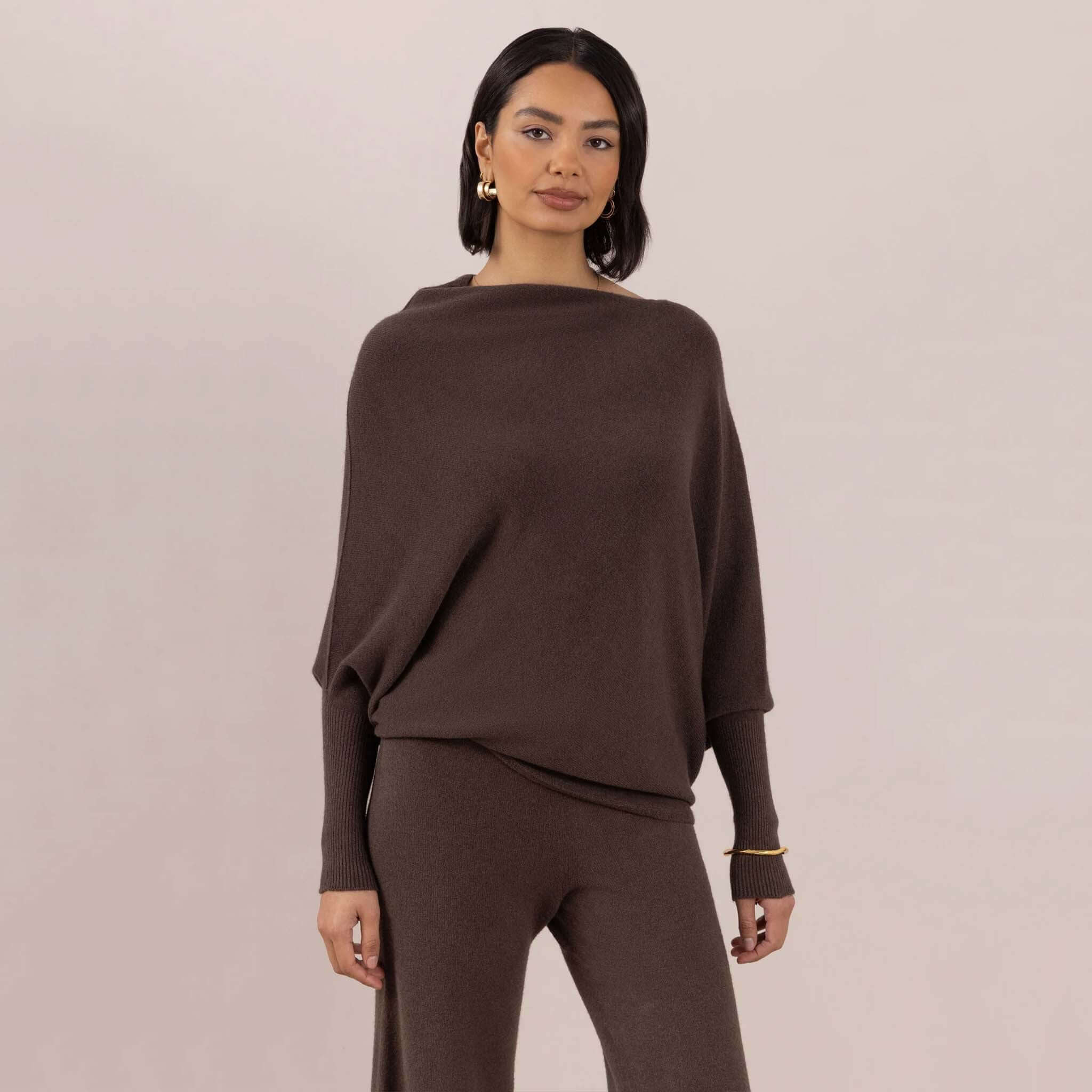 Charli Natalie Asymmetric Sweater - Dark Espresso worn by model, showcasing relaxed fit and off-shoulder style.