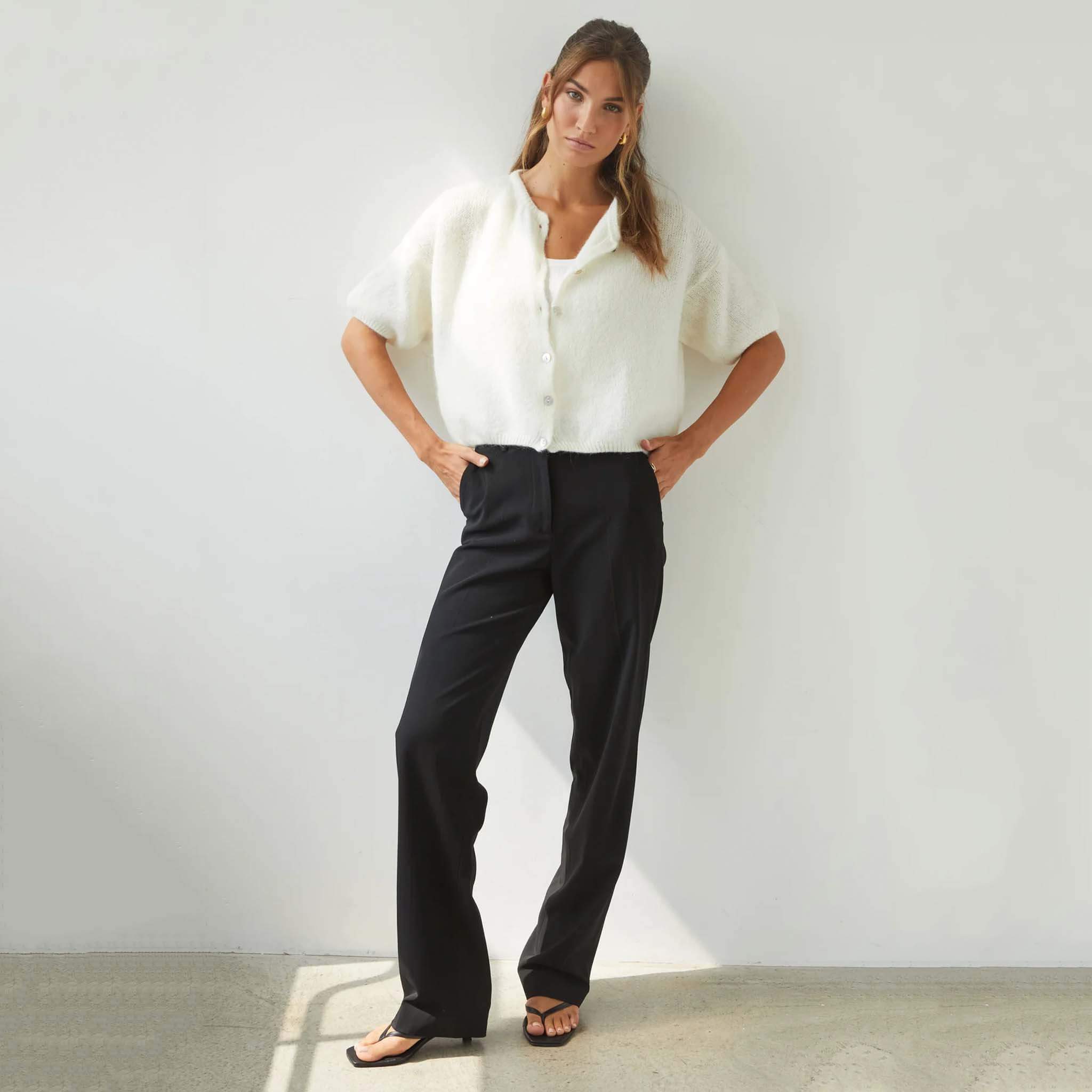 Charli Emme Mohair & Wool Blend Cardigan - Ivory styled with high-waisted trousers, featuring a cropped design and pearl buttons.