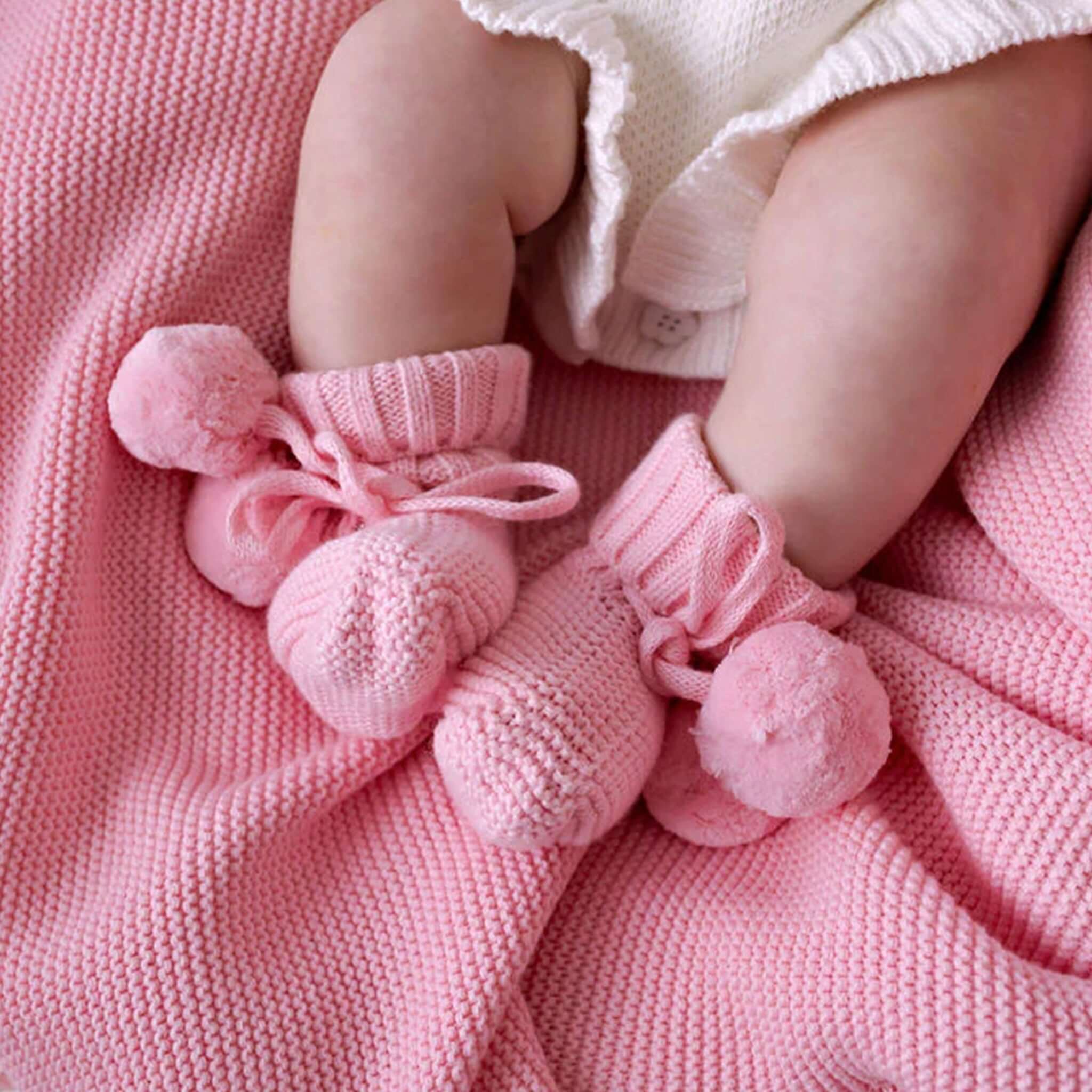 Confetti Kidz Frilly Knit Blanket - Soft Pink with cozy baby booties in soft pink.