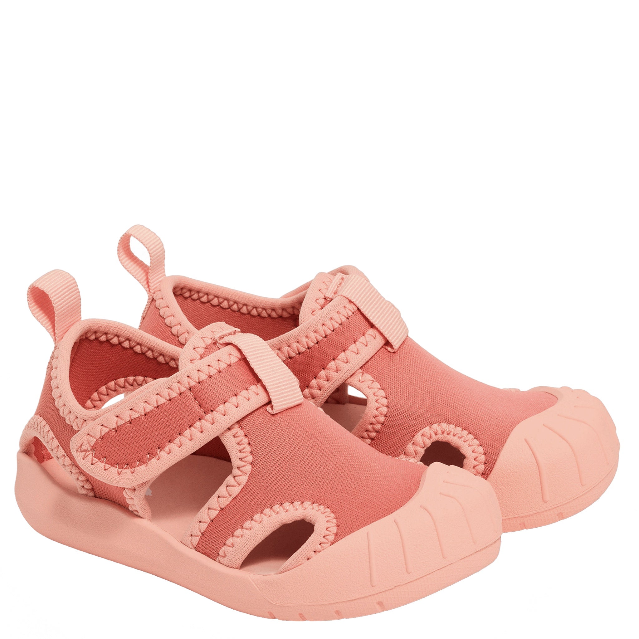 Pair of pink children's sandals on a white background