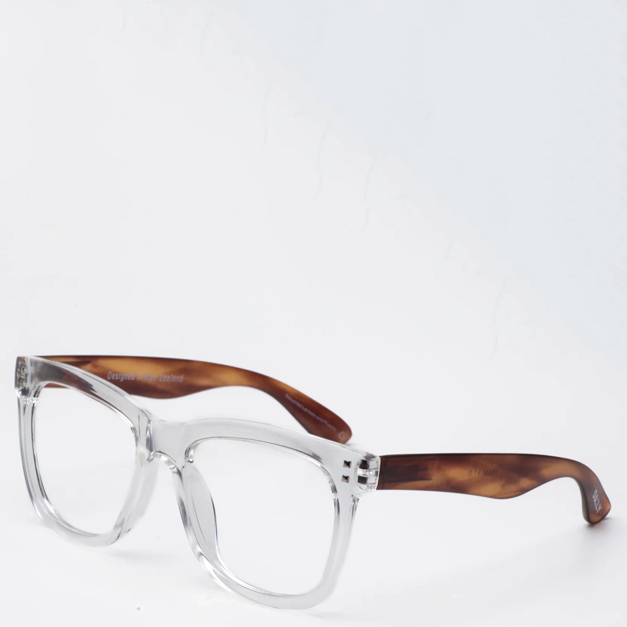 Eyeglasses with clear frame and brown tortoiseshell arms on a white background