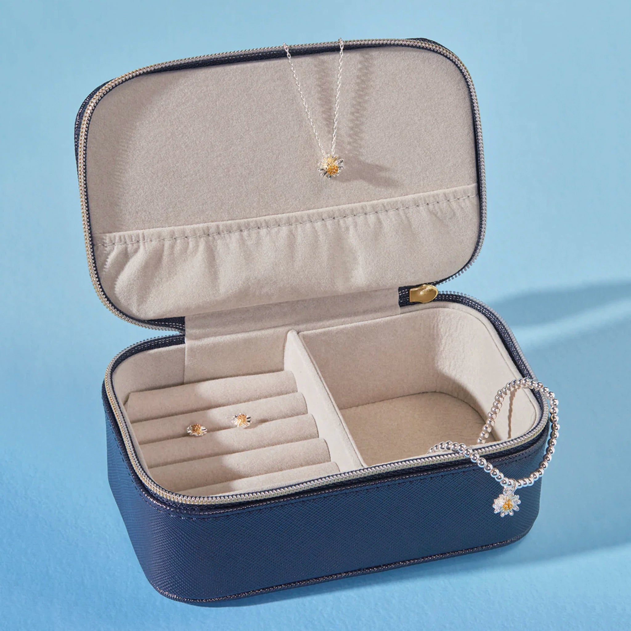 Navy jewelry box with jewelry inside
