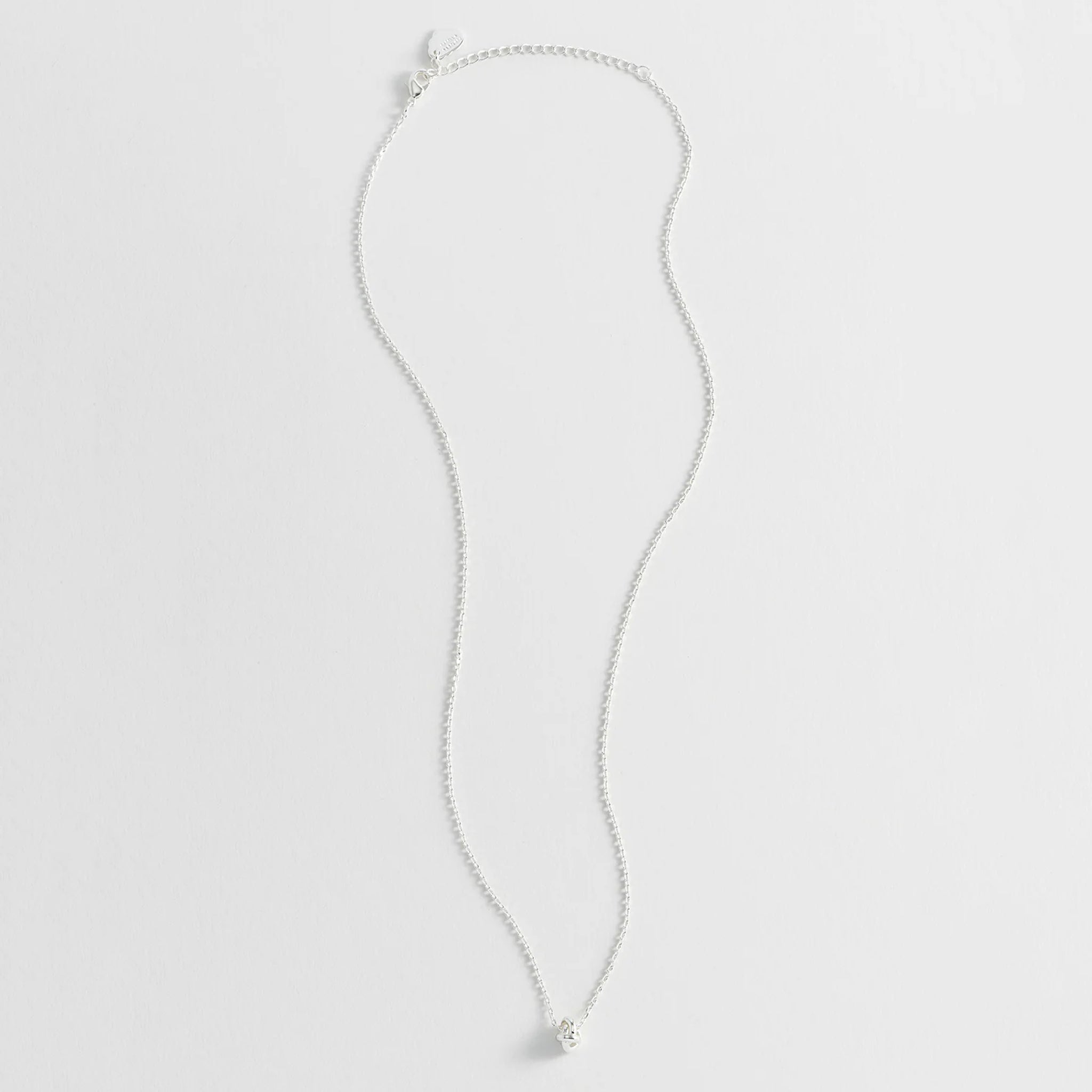 Silver knot necklace.