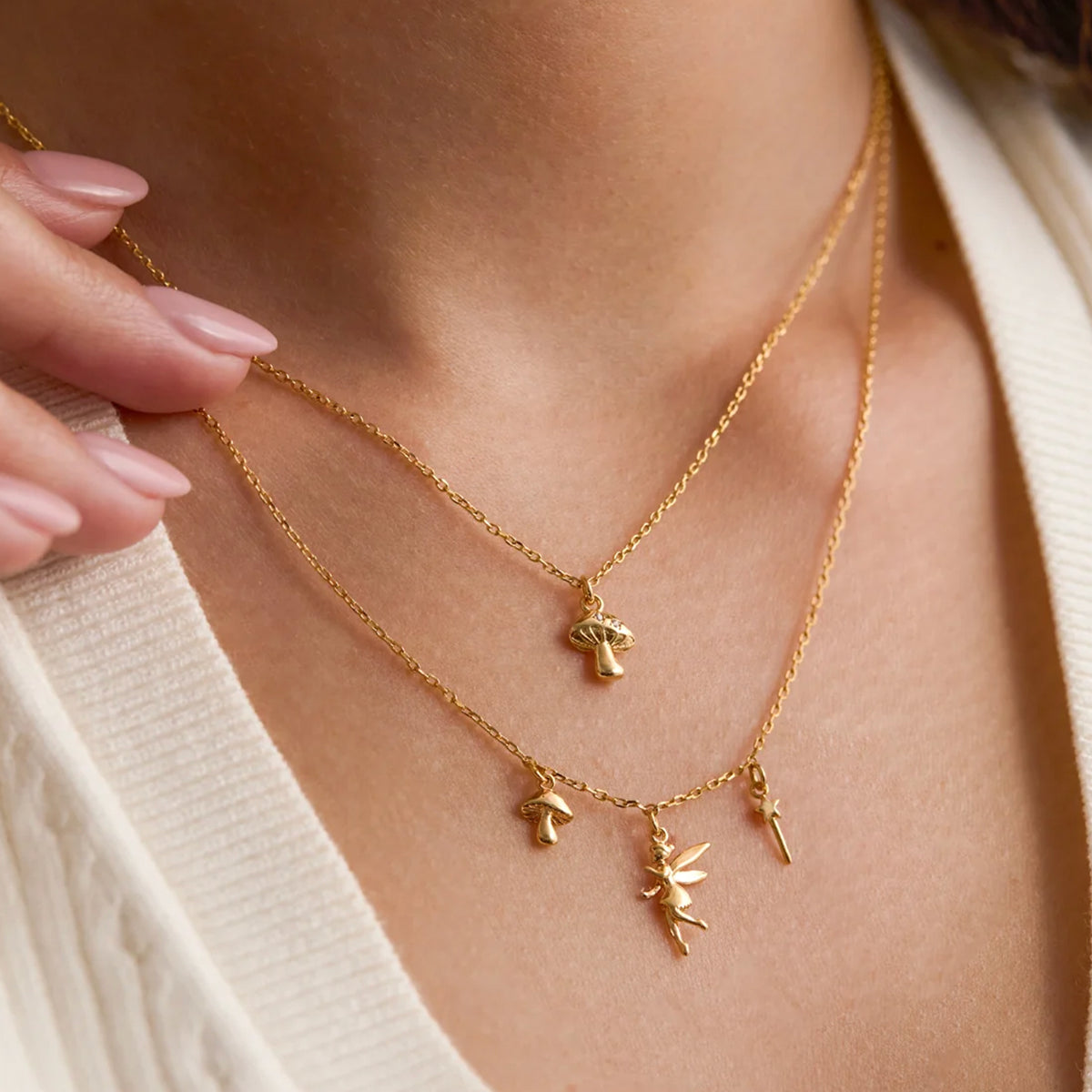 Estella Bartlett Mushroom Necklace worn layered with a second charm chain