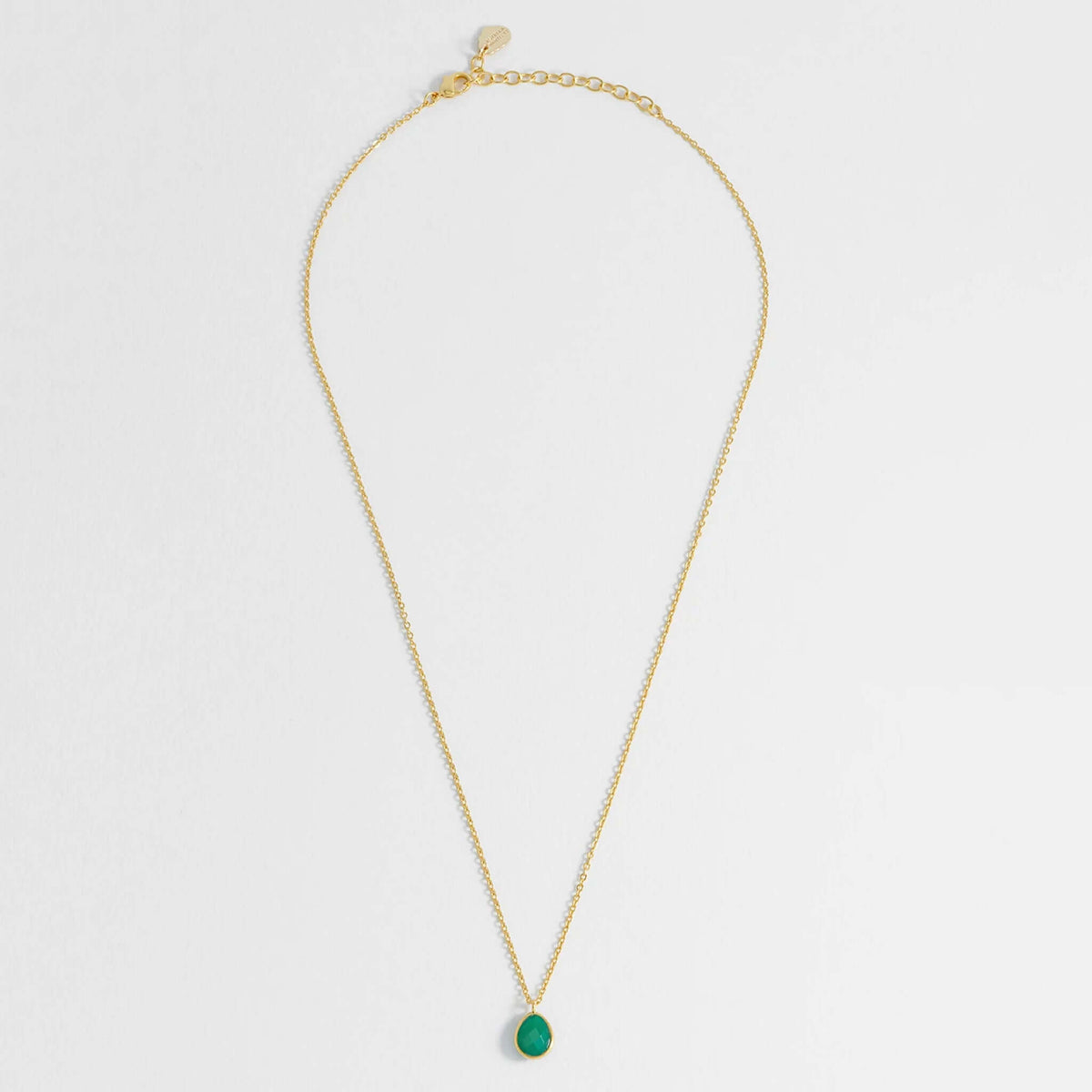Estella Bartlett Wellness Faceted Teardrop Necklace - Green Agate on a gold-plated chain with a vibrant green agate pendant.