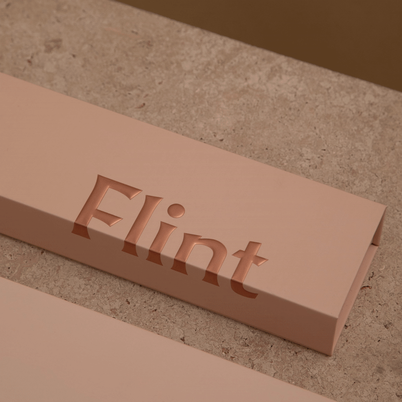 Flint rose gold lighter in a box