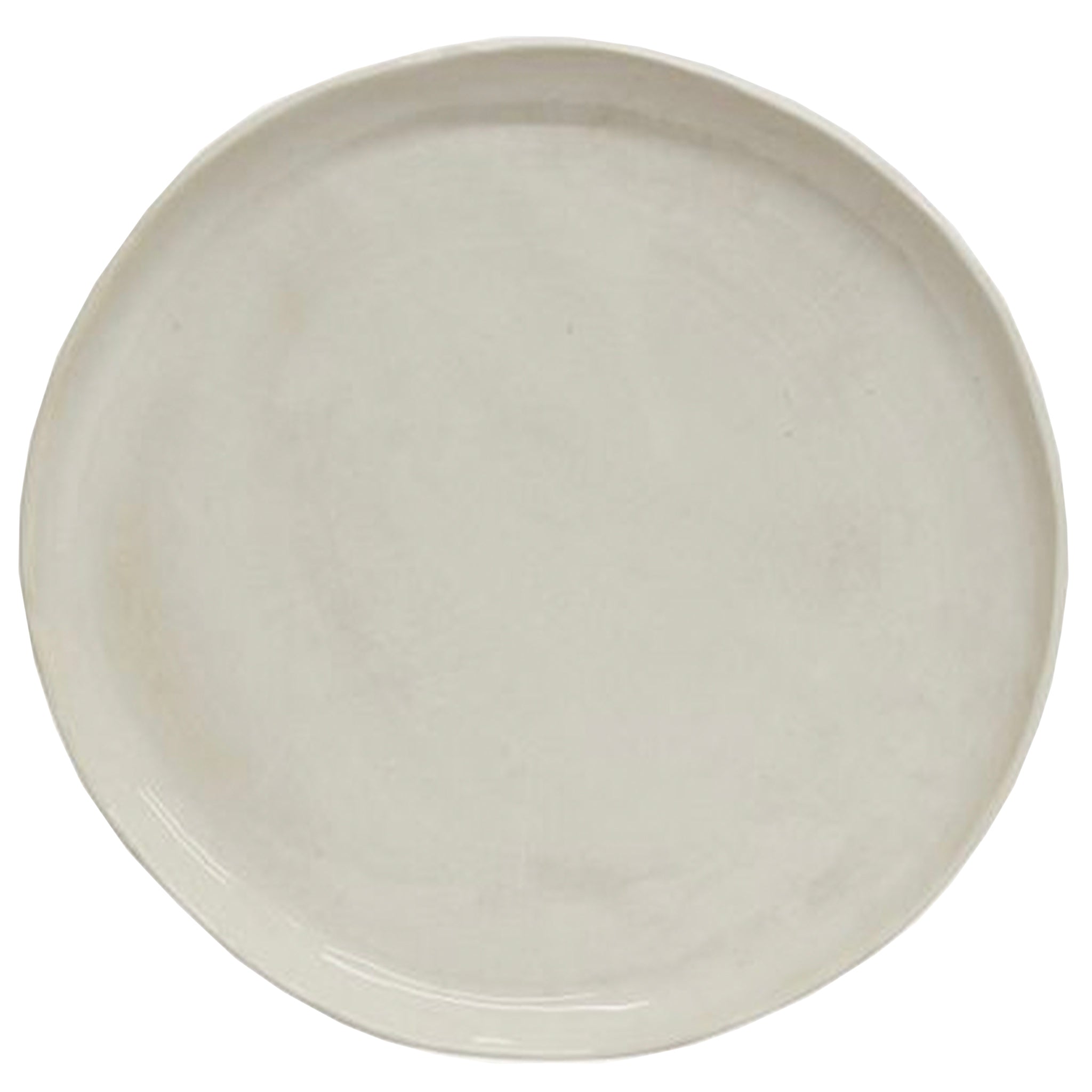 A rustic white stoneware dinner plate with a glazed finish.