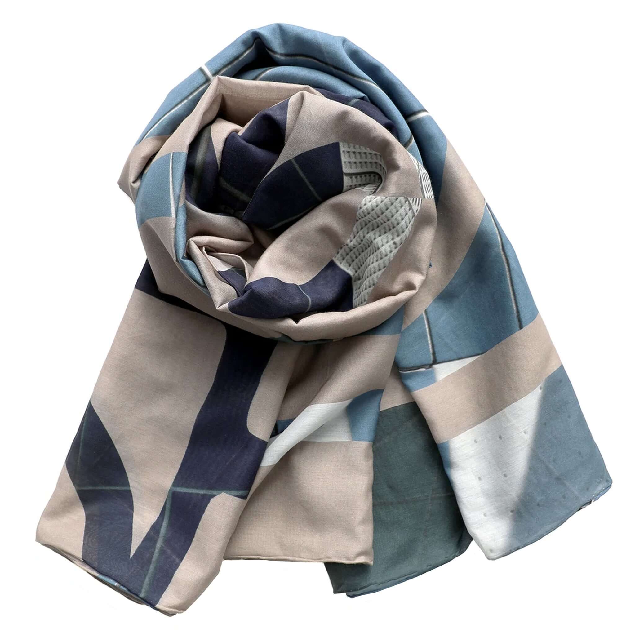 Patterned scarf with blue, beige, and white colors on a white background